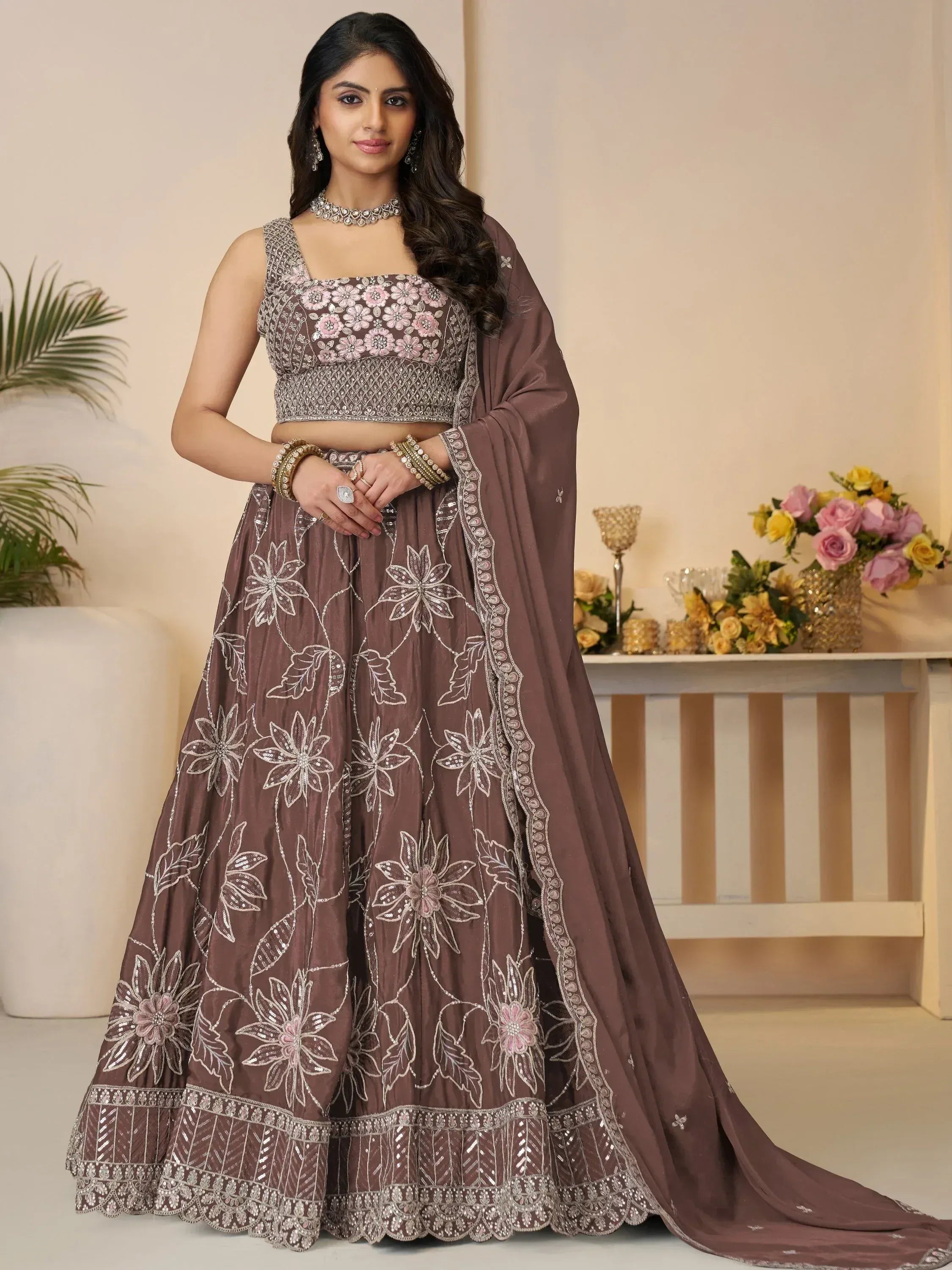 Elegant brown lehenga choli with floral embroidery and sequin detailing, perfect for Indian ethnic occasions.
