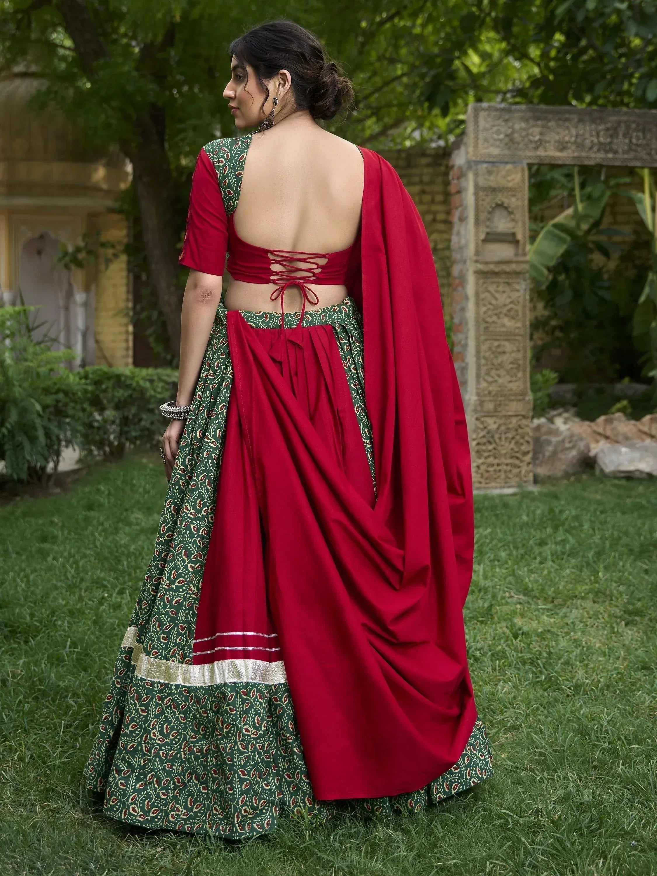 Red and green printed lehenga choli with back tie blouse, perfect for Indian ethnic occasions