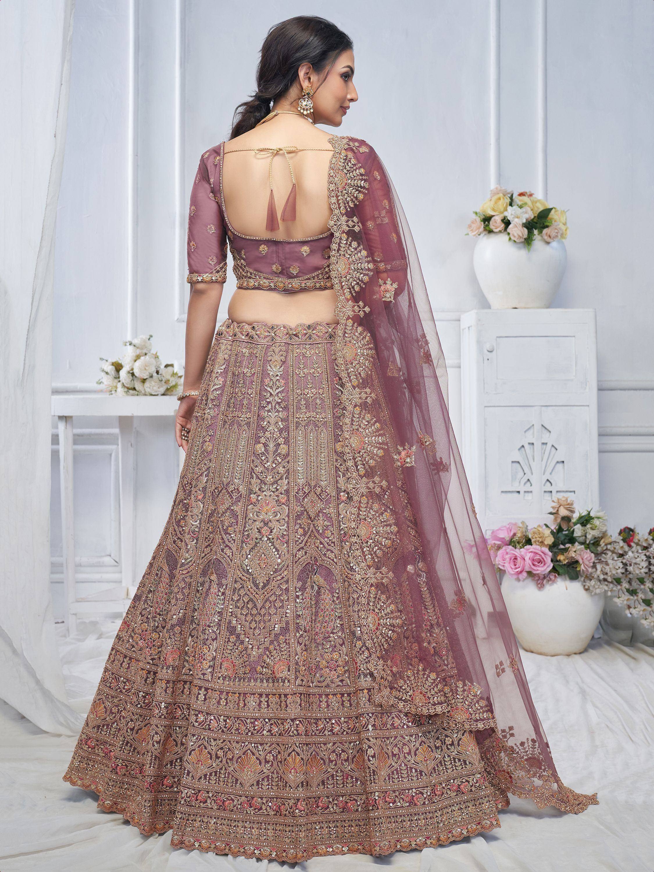 Elegant mauve lehenga choli with gold embroidery, back view, perfect for Indian weddings and festive occasions.