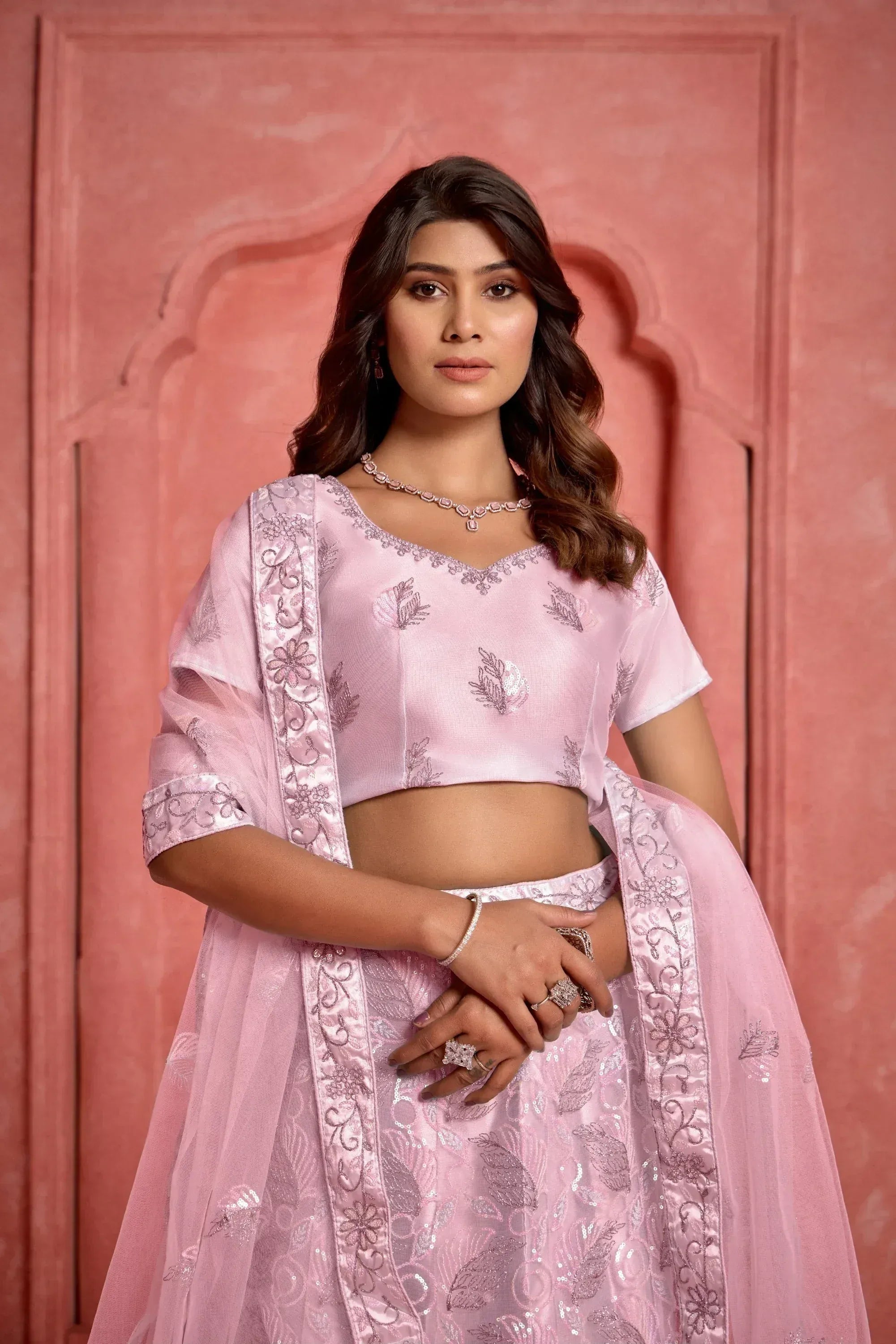 Pink embroidered lehenga choli with floral detailing, perfect for Indian ethnic wear occasions