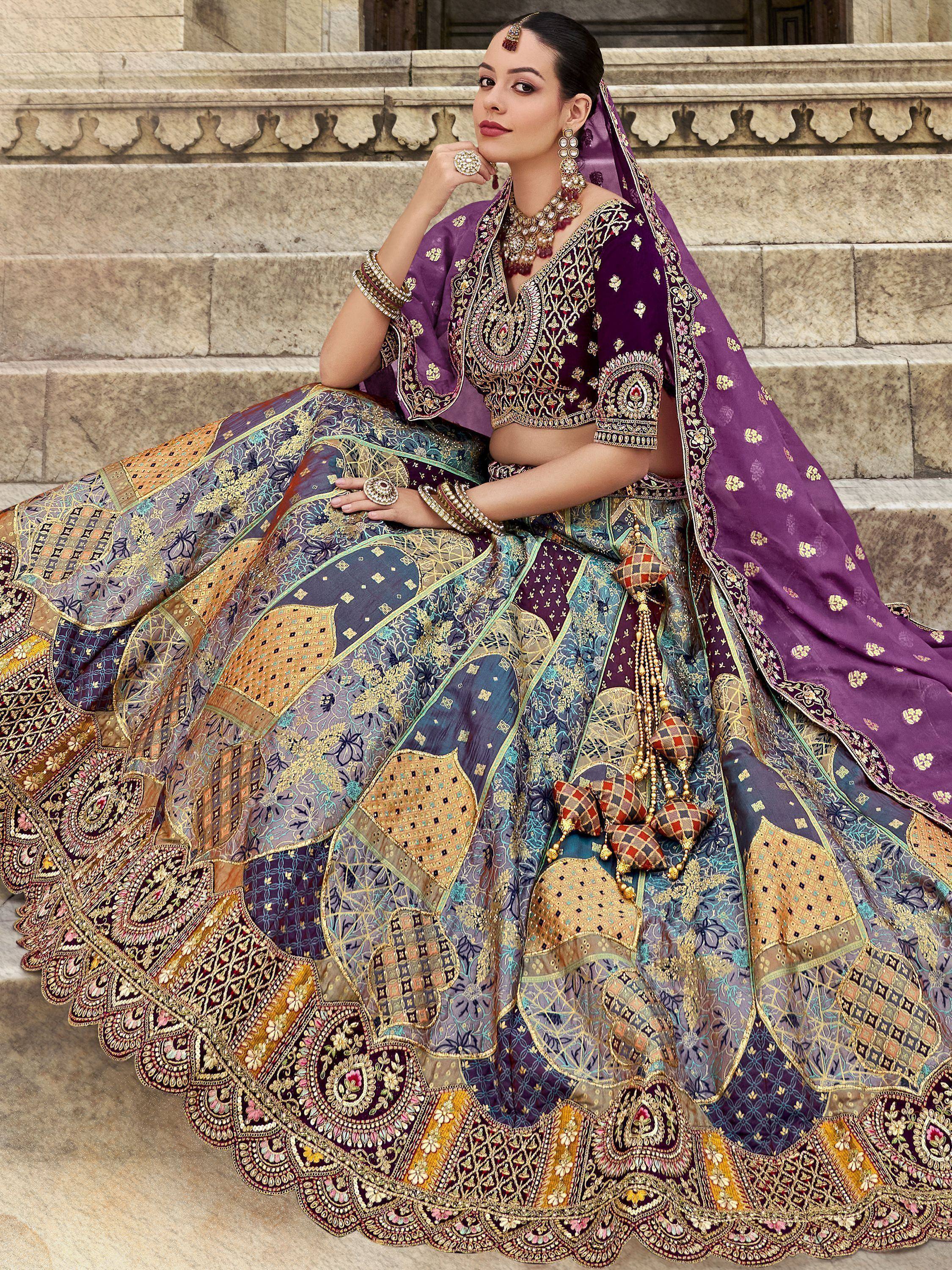 Elegant purple lehenga choli with intricate gold embroidery, perfect for Indian weddings and festive occasions.