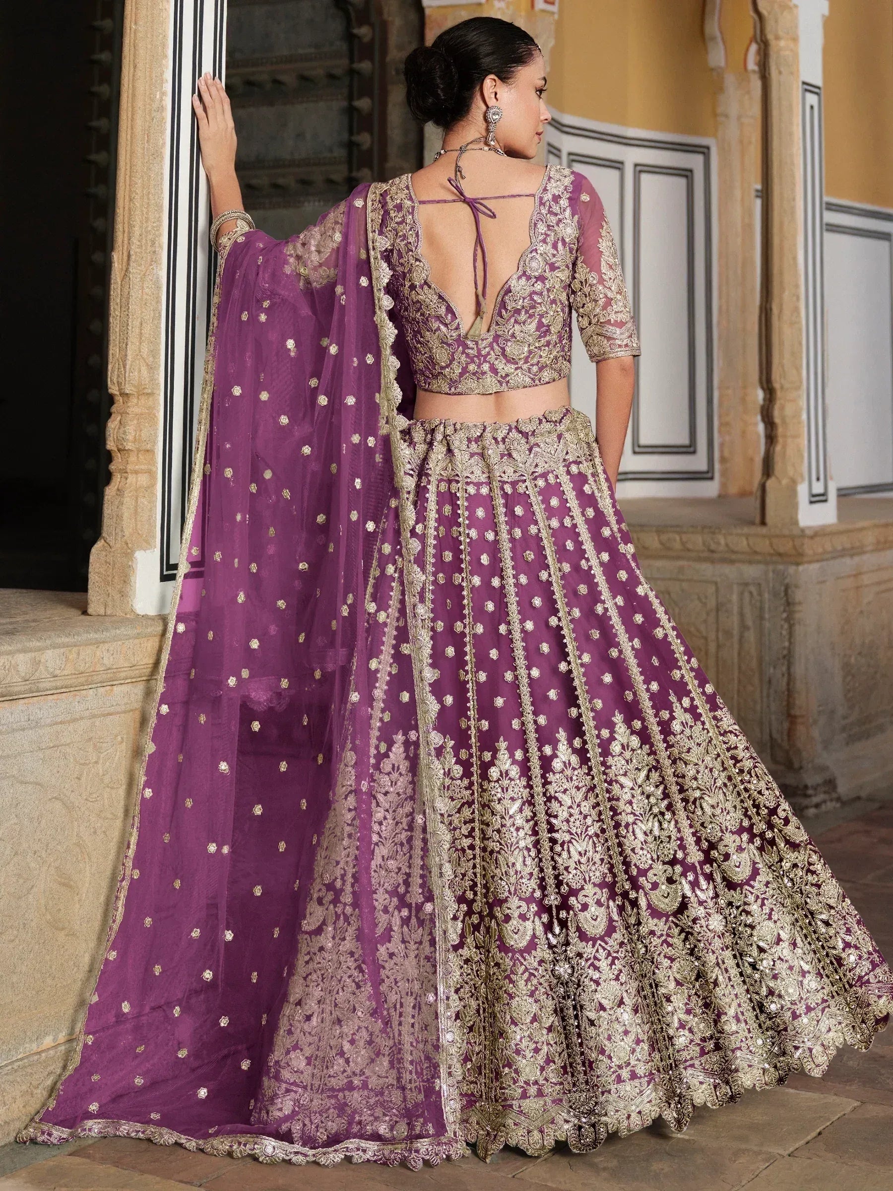 Purple and gold embroidered lehenga choli with sheer dupatta, perfect for Indian weddings and festive occasions