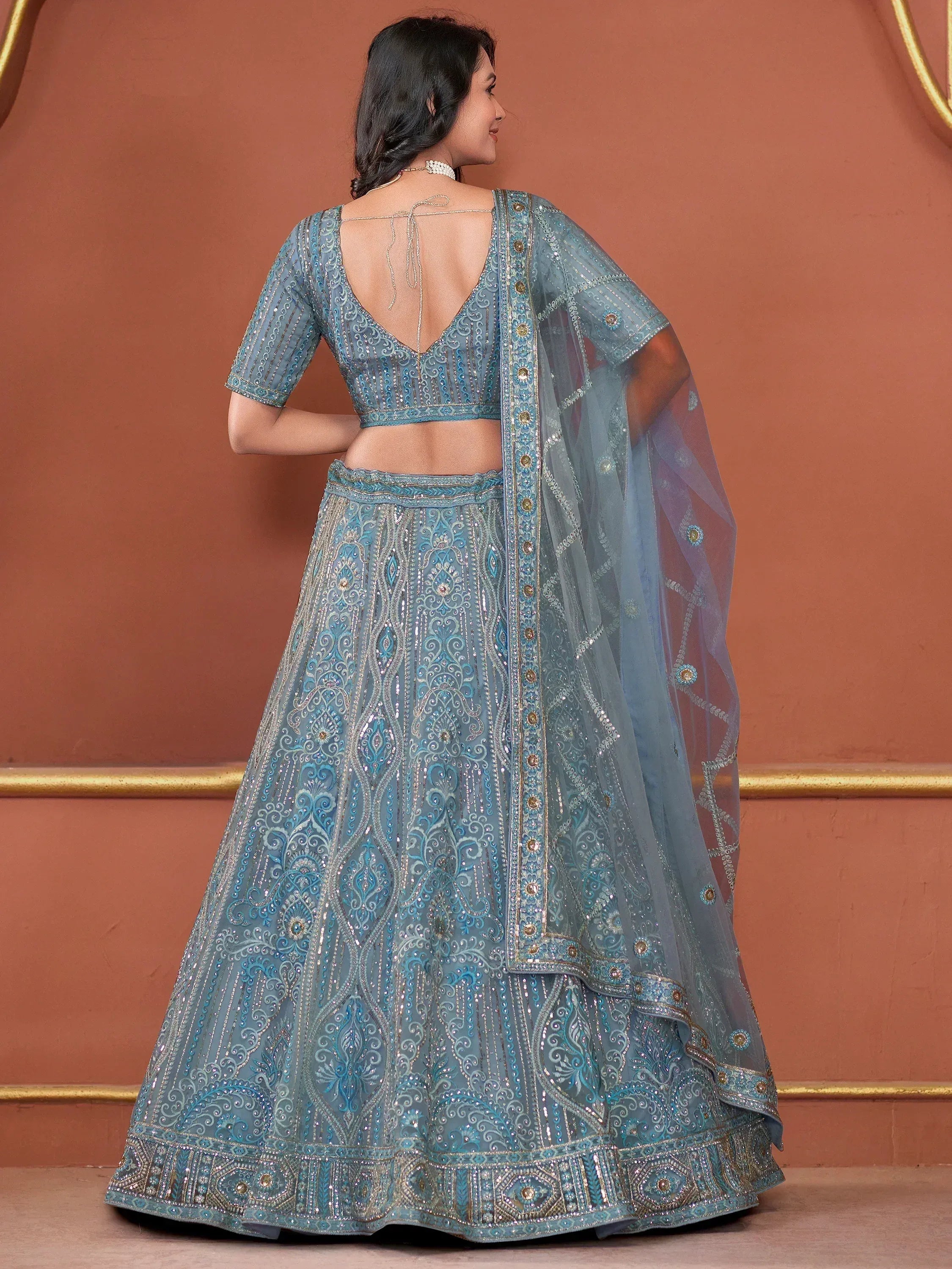 Blue embroidered lehenga choli with sheer dupatta, back view, Indian ethnic wear