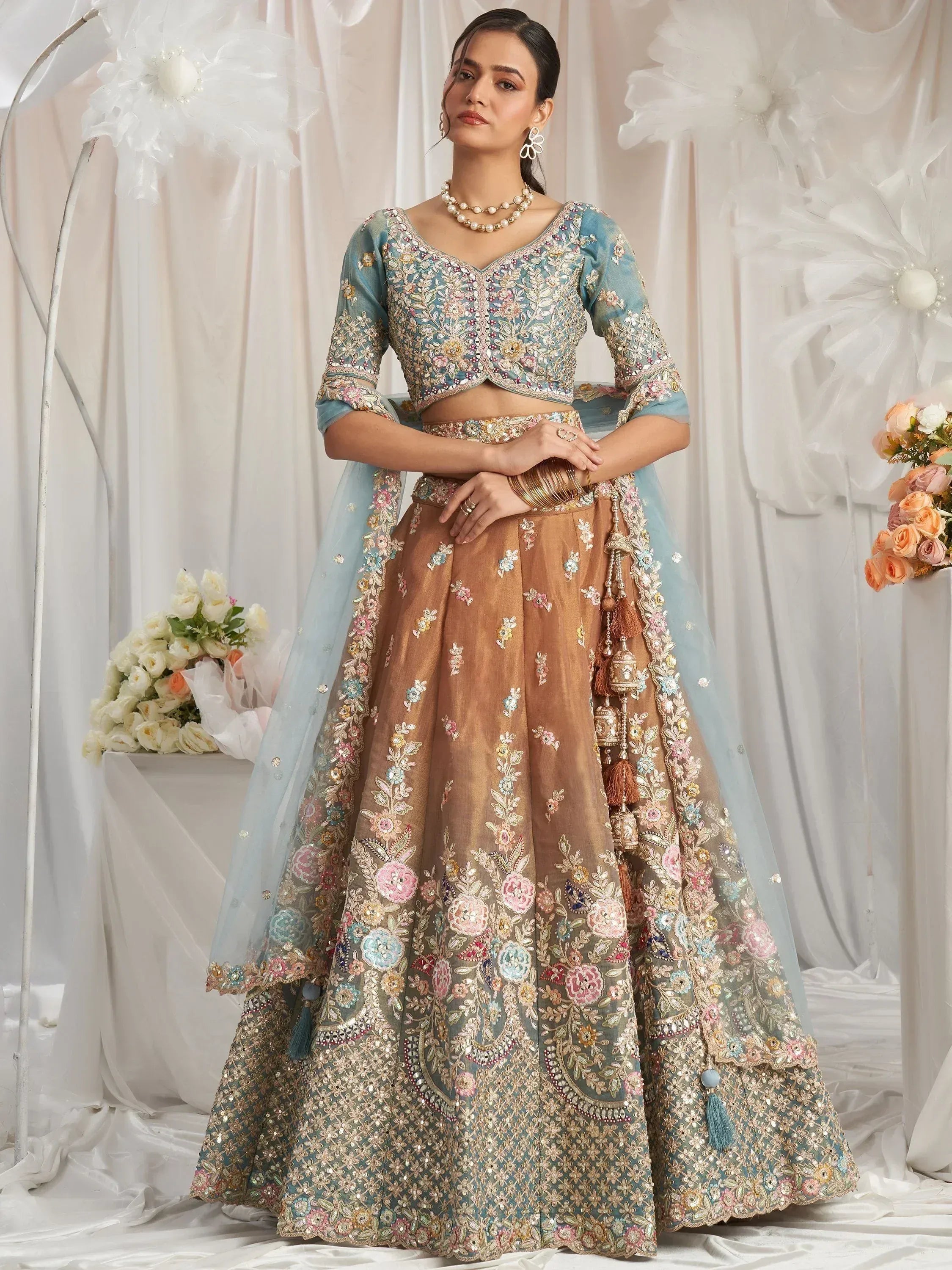 Designer lehenga choli with floral embroidery, perfect for weddings and ethnic events