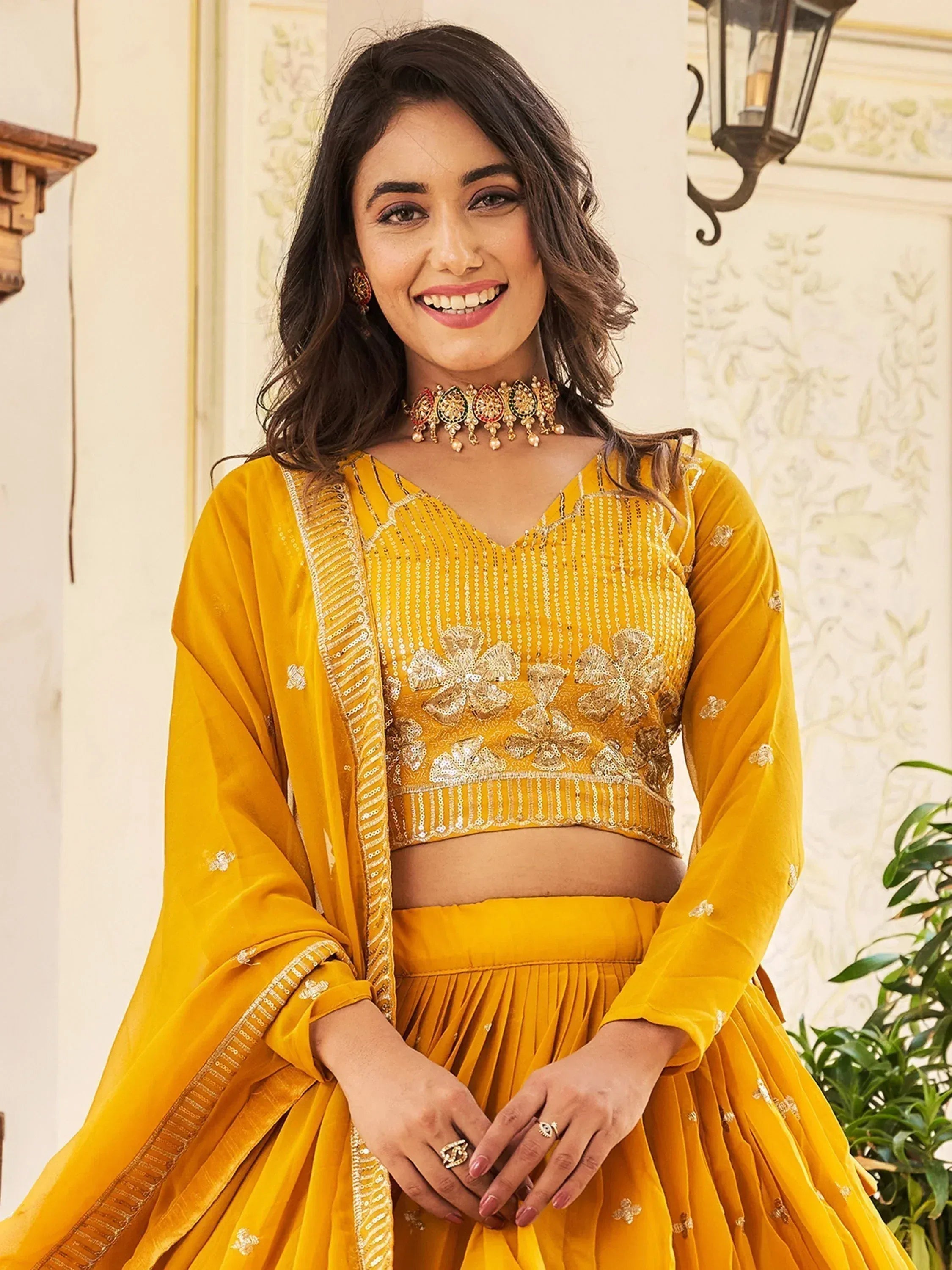 Yellow designer lehenga choli with sequin embroidery and matching dupatta for Indian ethnic wear