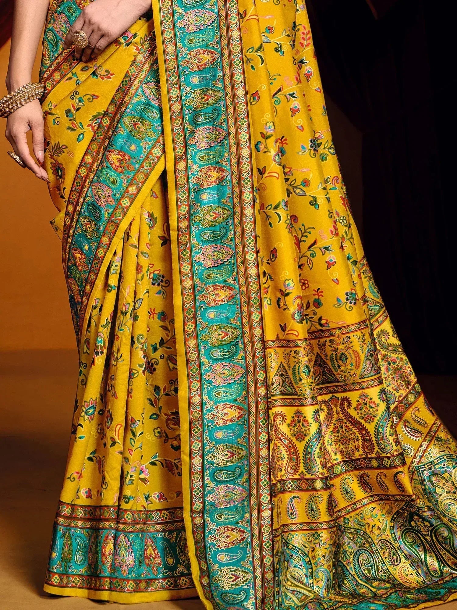 Yellow floral and paisley printed saree with turquoise border, ethnic Indian wear