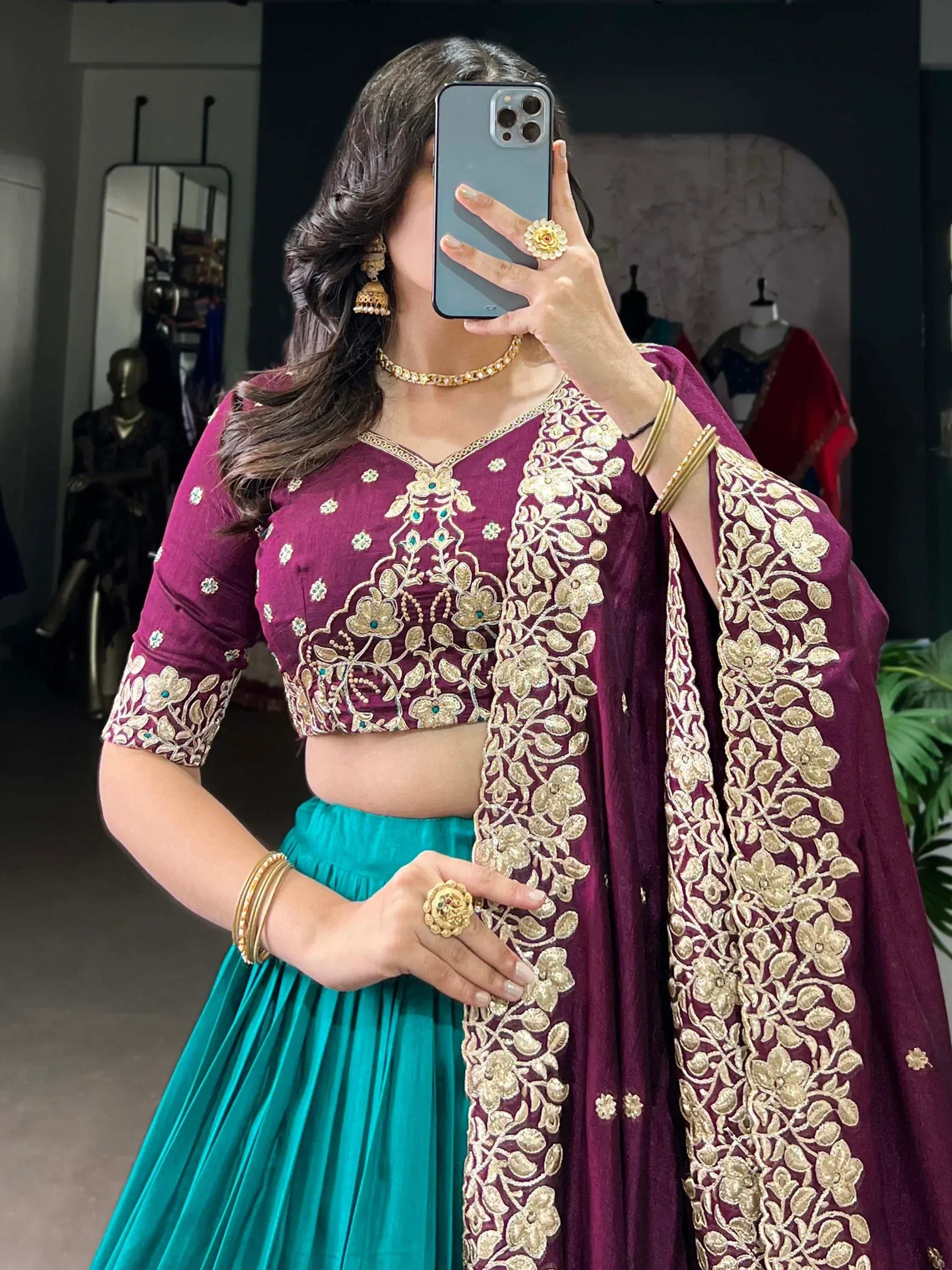 Purple and teal lehenga choli with gold floral embroidery, perfect for Indian ethnic wear events
