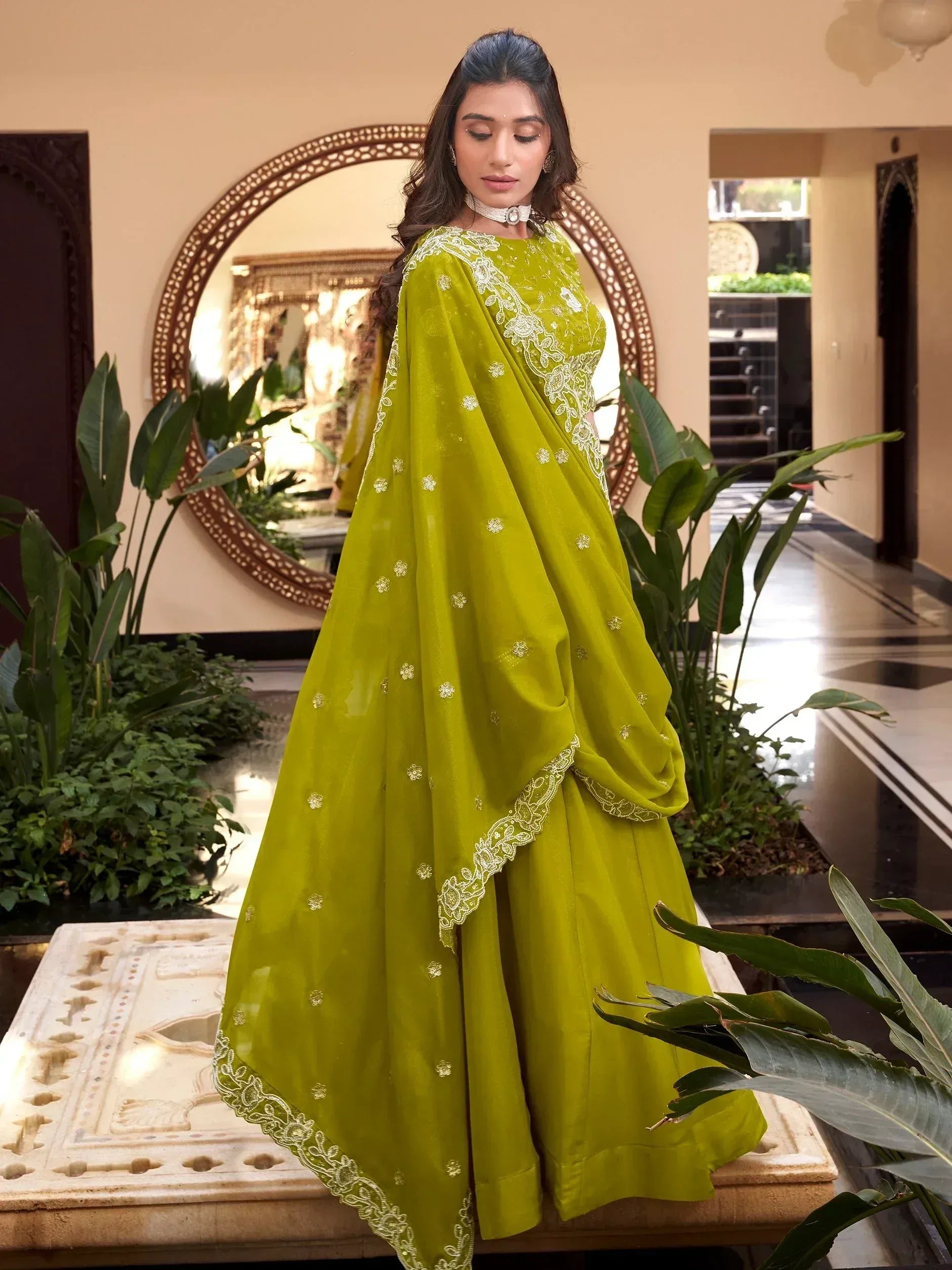 Lime green designer lehenga choli with white embroidery, perfect for Indian ethnic wear occasions.