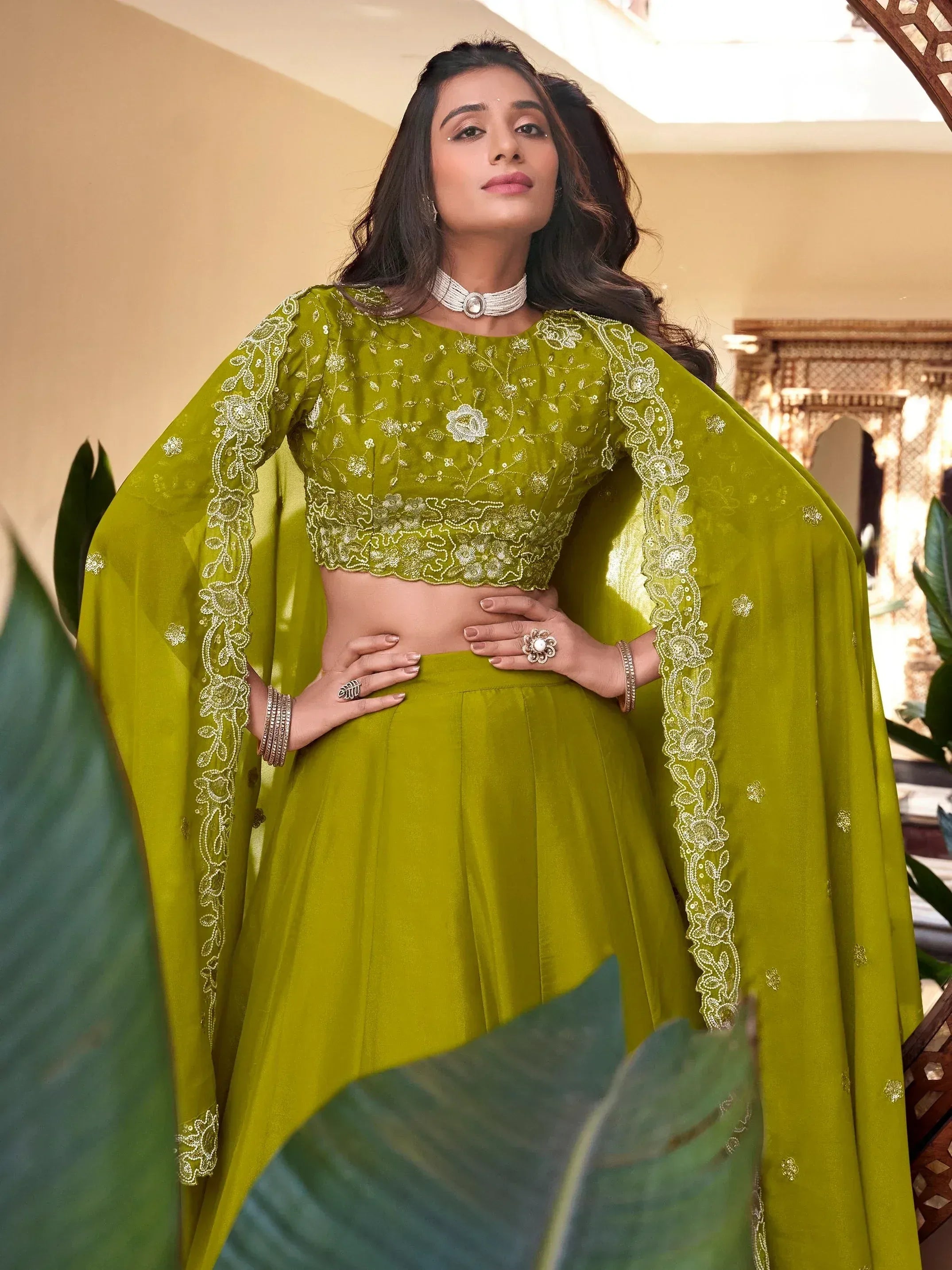 Olive green embroidered lehenga choli with floral detailing and cape sleeves for Indian ethnic wear