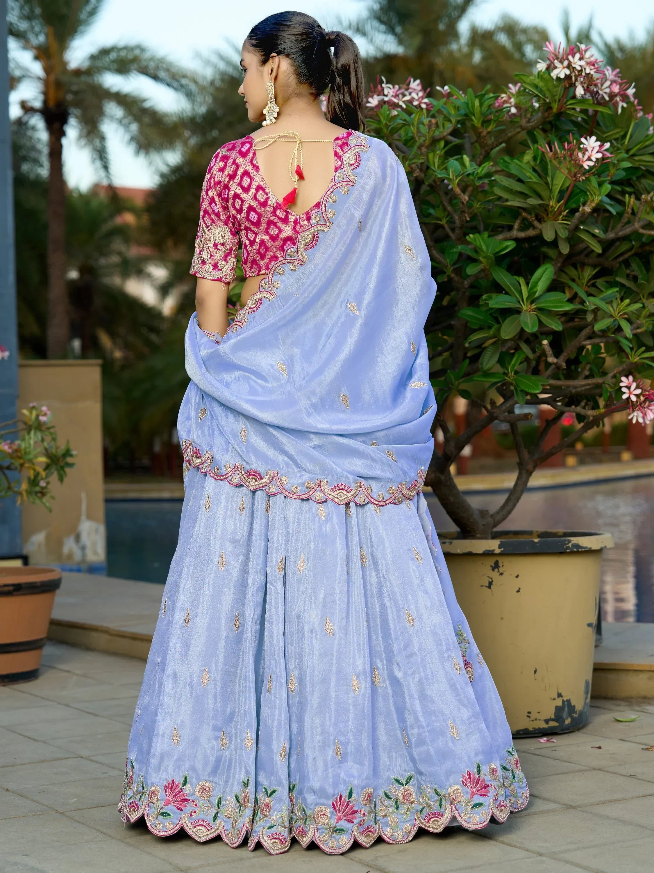 Light blue embroidered lehenga choli with pink blouse, perfect for Indian ethnic wear occasions