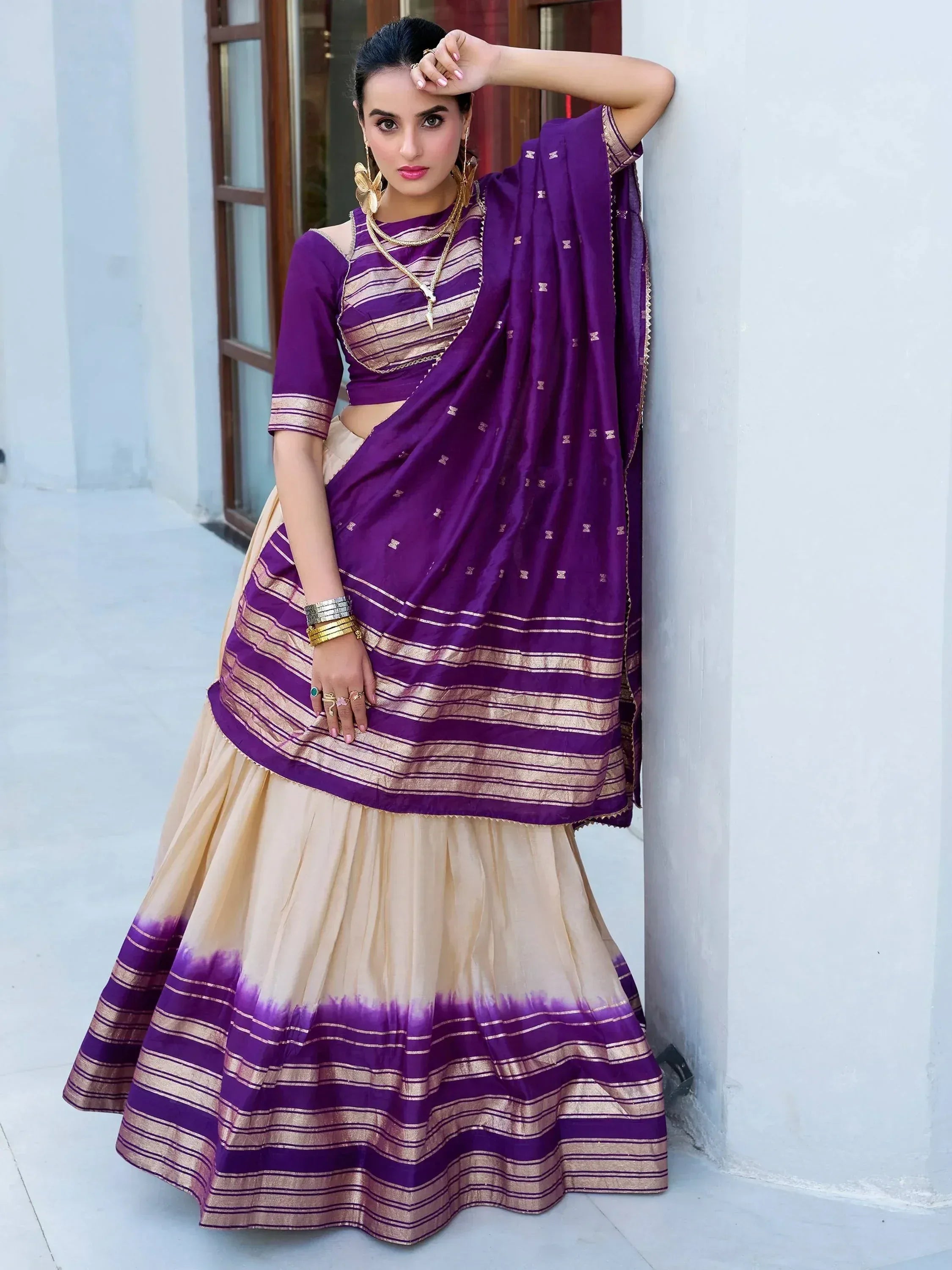 Purple and beige designer lehenga choli with gold stripes, perfect for Indian ethnic wear occasions