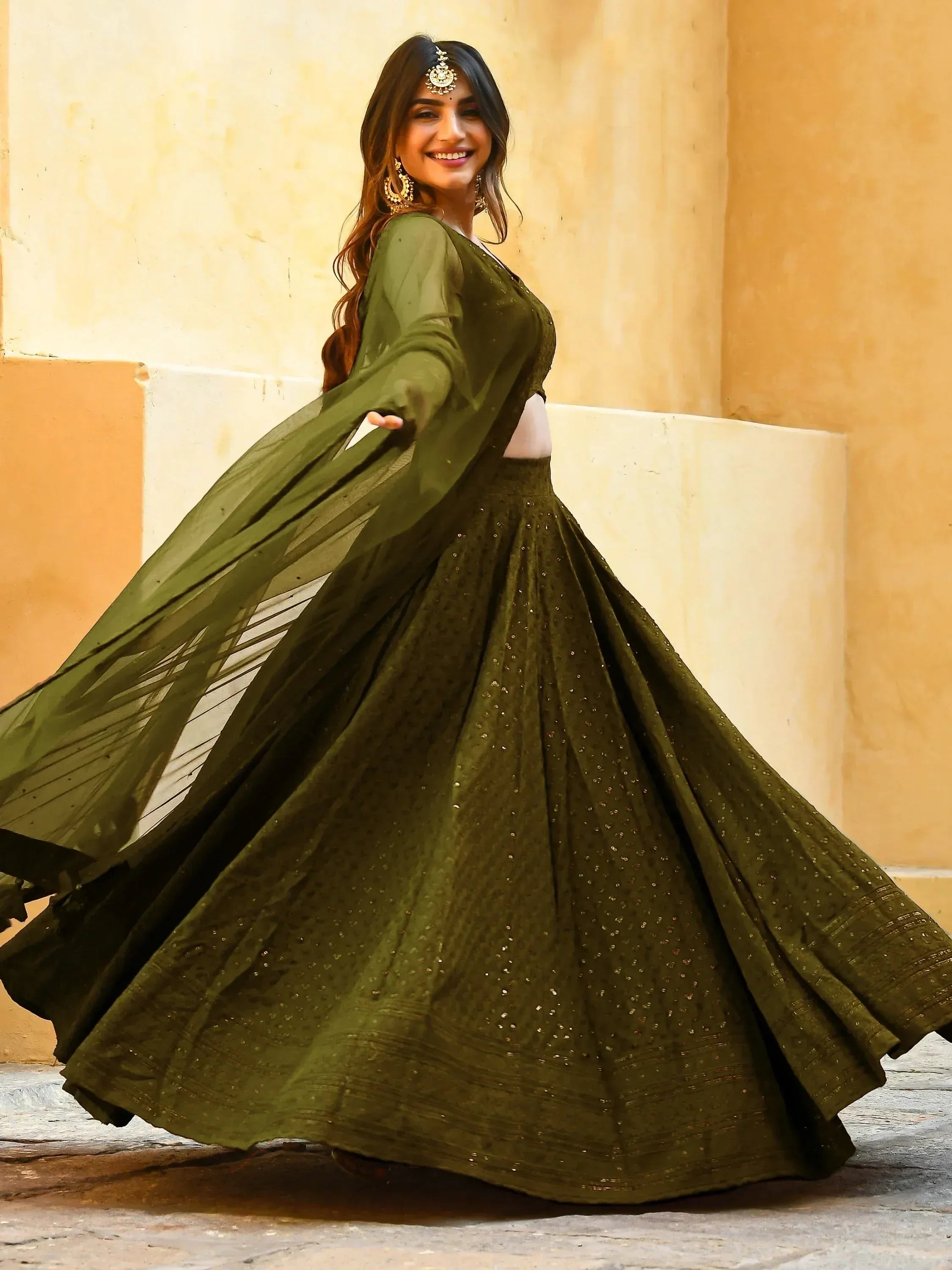 Olive green designer lehenga choli with sheer dupatta, perfect for Indian ethnic wear occasions