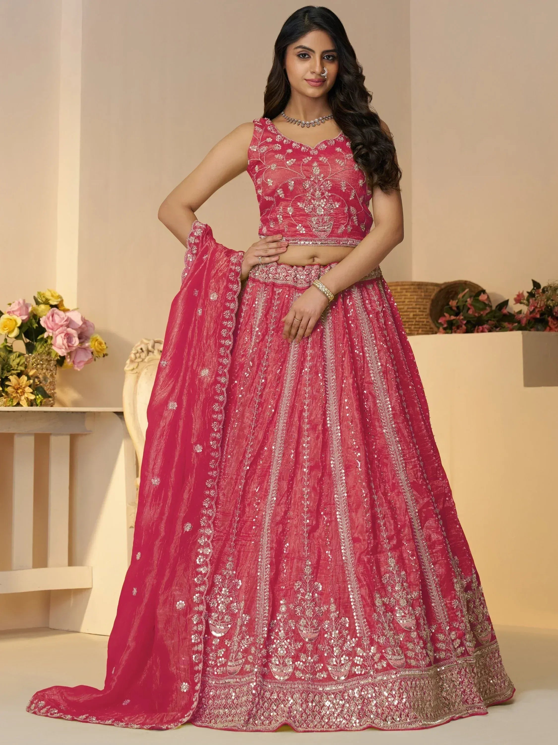 Pink embroidered lehenga choli with floral sequin work, perfect for Indian weddings and festive occasions.