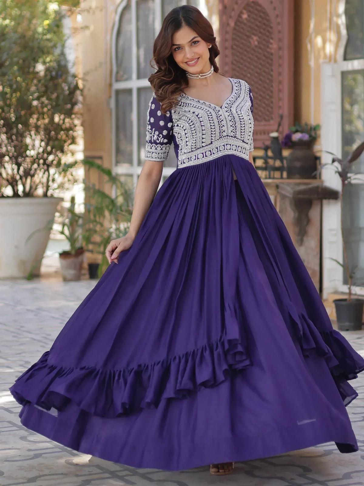 Purple ethnic gown with silver embroidery and ruffled skirt, perfect for Indian festive occasions