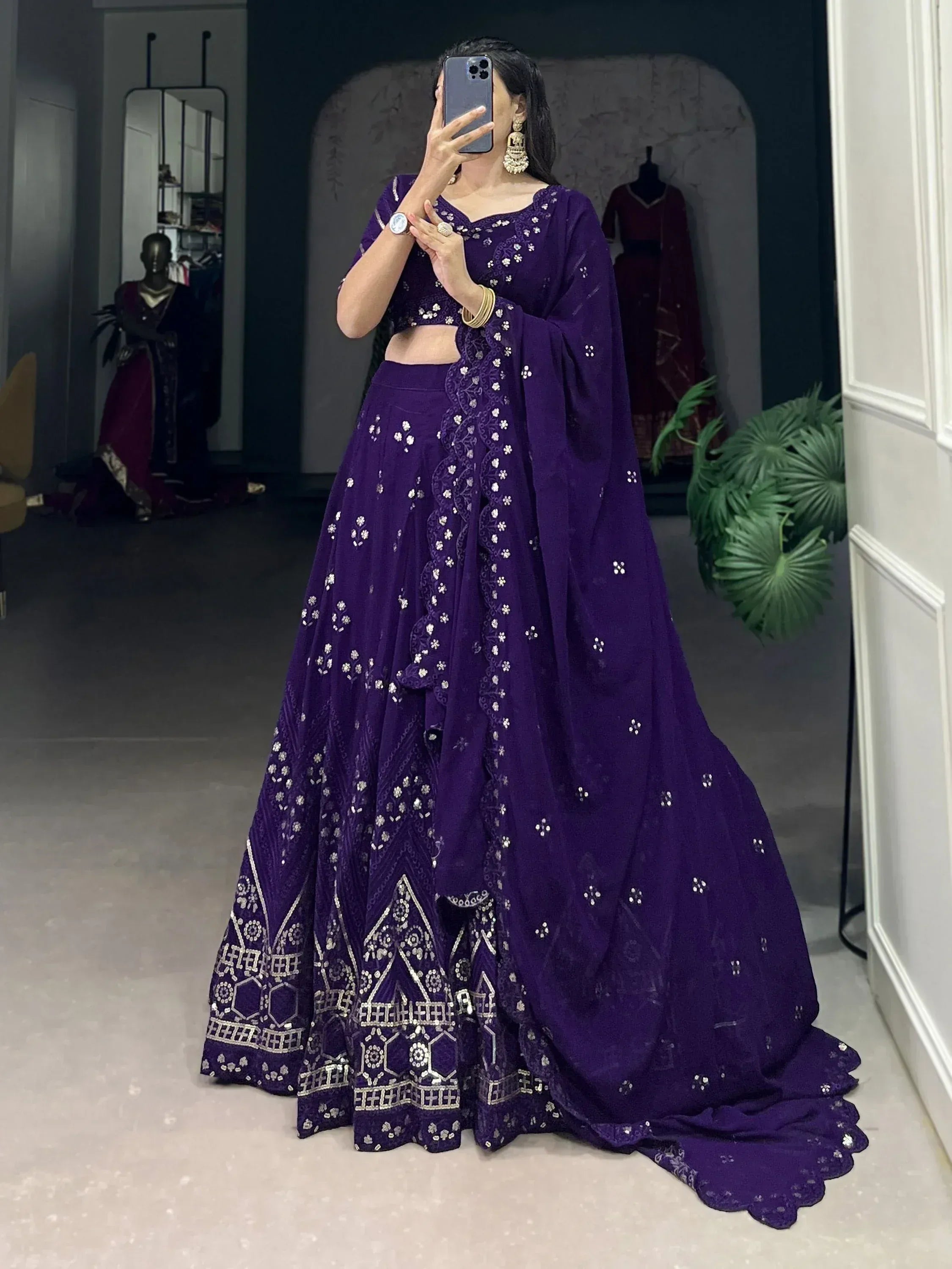 Purple designer lehenga choli with silver embroidery, perfect for weddings and festive occasions.