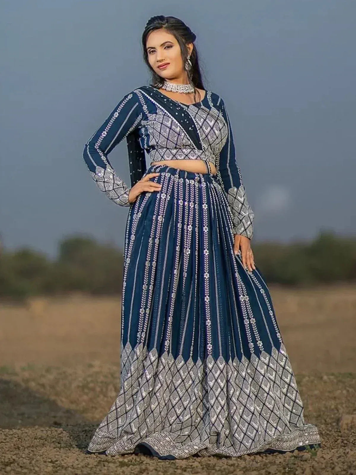 Navy blue and silver embroidered lehenga choli with geometric patterns, perfect for Indian ethnic occasions.
