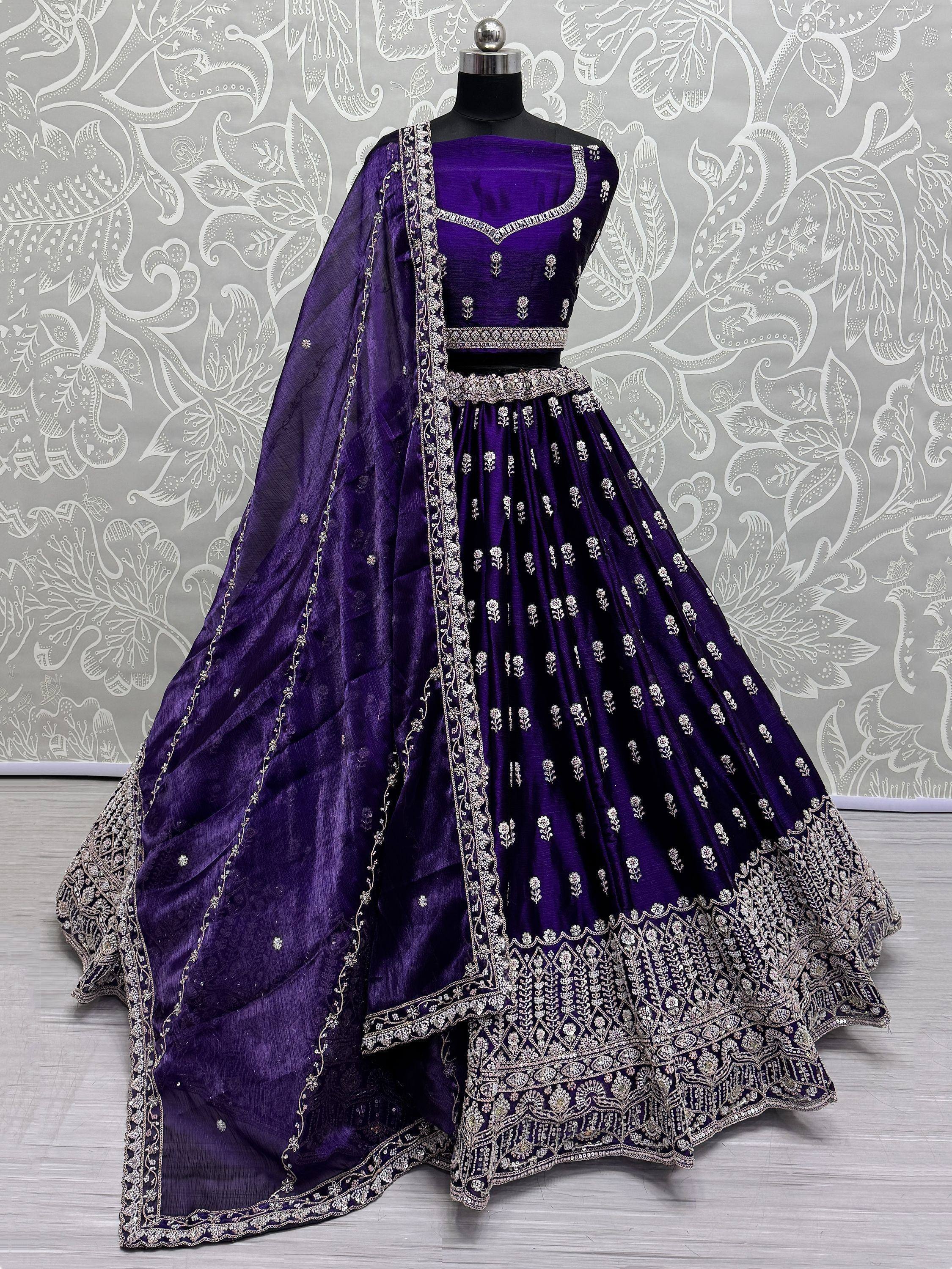 Purple designer lehenga choli with silver embroidery, perfect for Indian ethnic wear occasions.