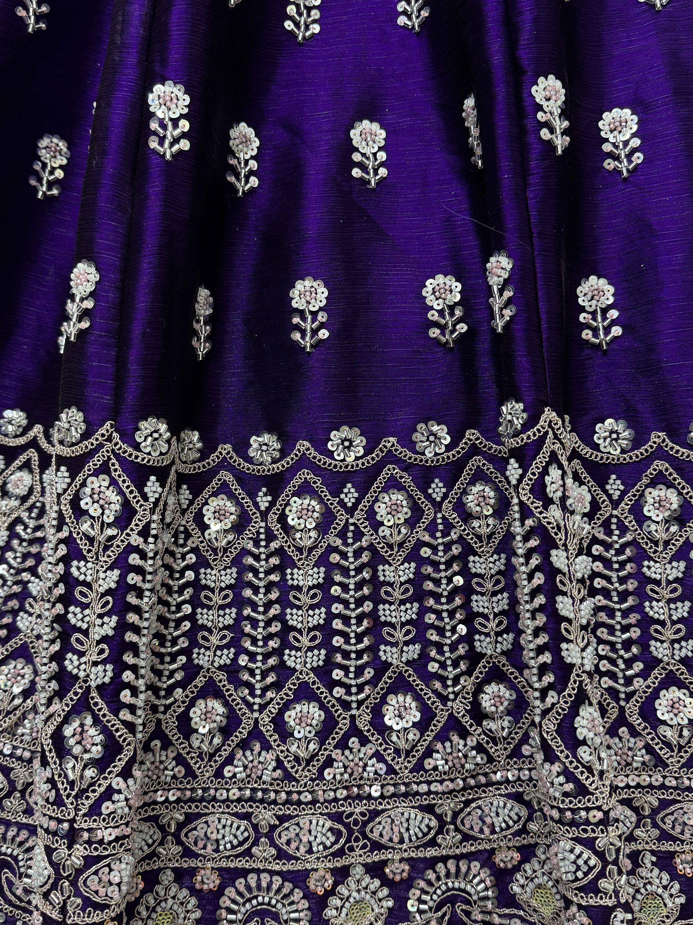 Purple ethnic gown with intricate silver bead and sequin floral embroidery, perfect for Indian occasions.