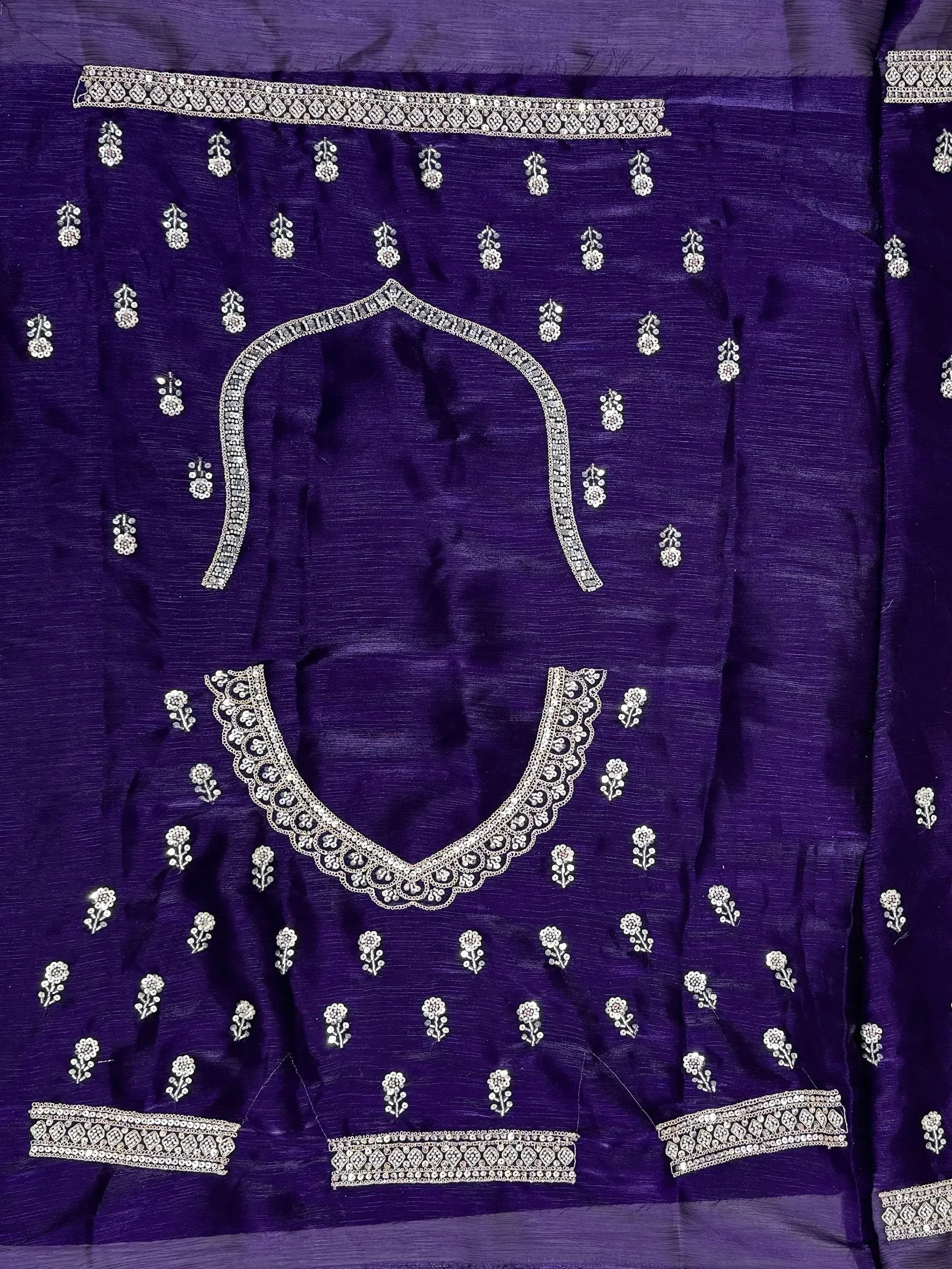 Purple ethnic wear with intricate silver embroidery and floral motifs, perfect for Indian designer lehenga or saree