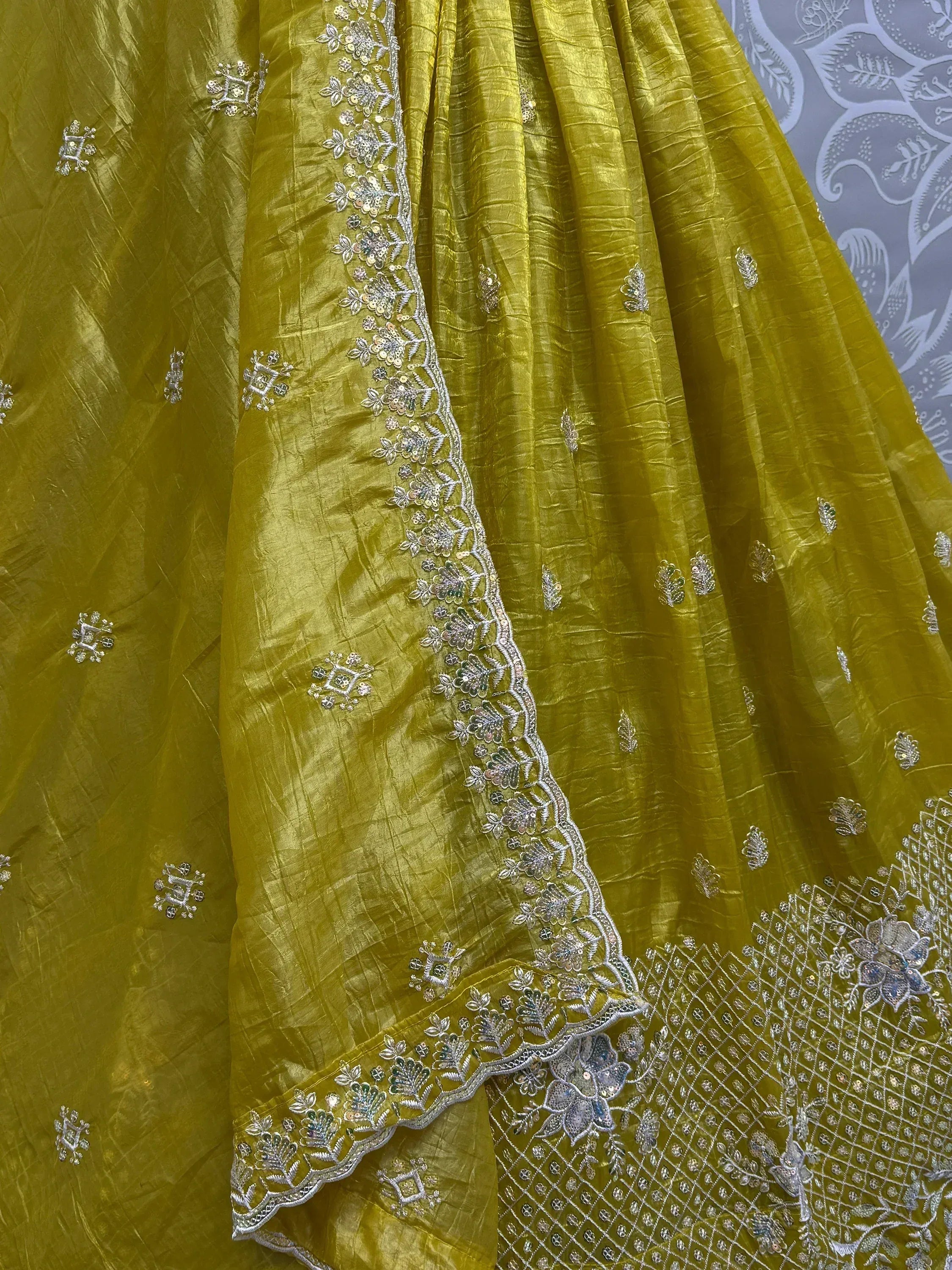 Olive green ethnic gown with silver floral embroidery and sequin detailing for festive occasions
