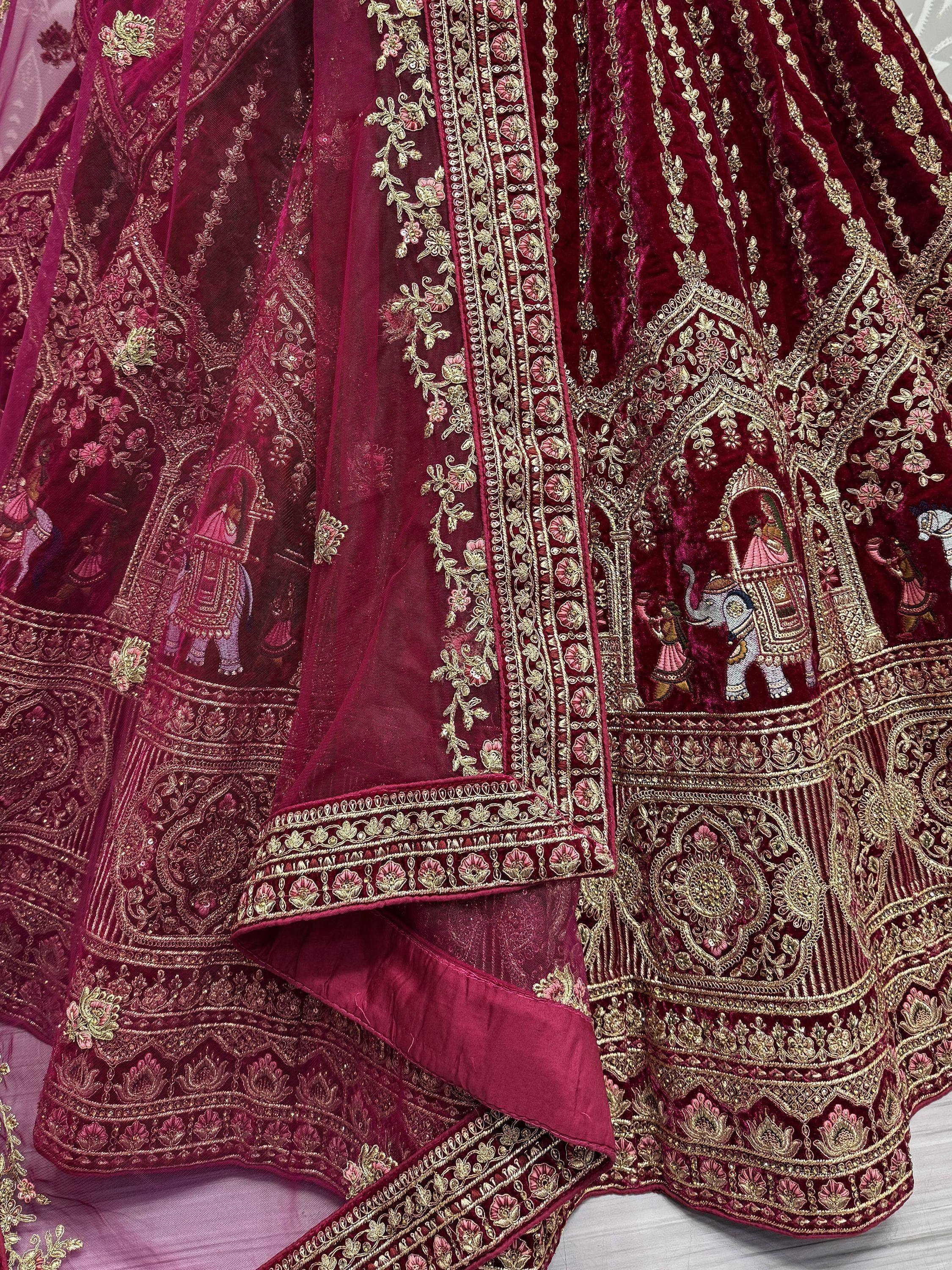 Maroon velvet lehenga with gold embroidery and elephant motifs, perfect for Indian ethnic wear.
