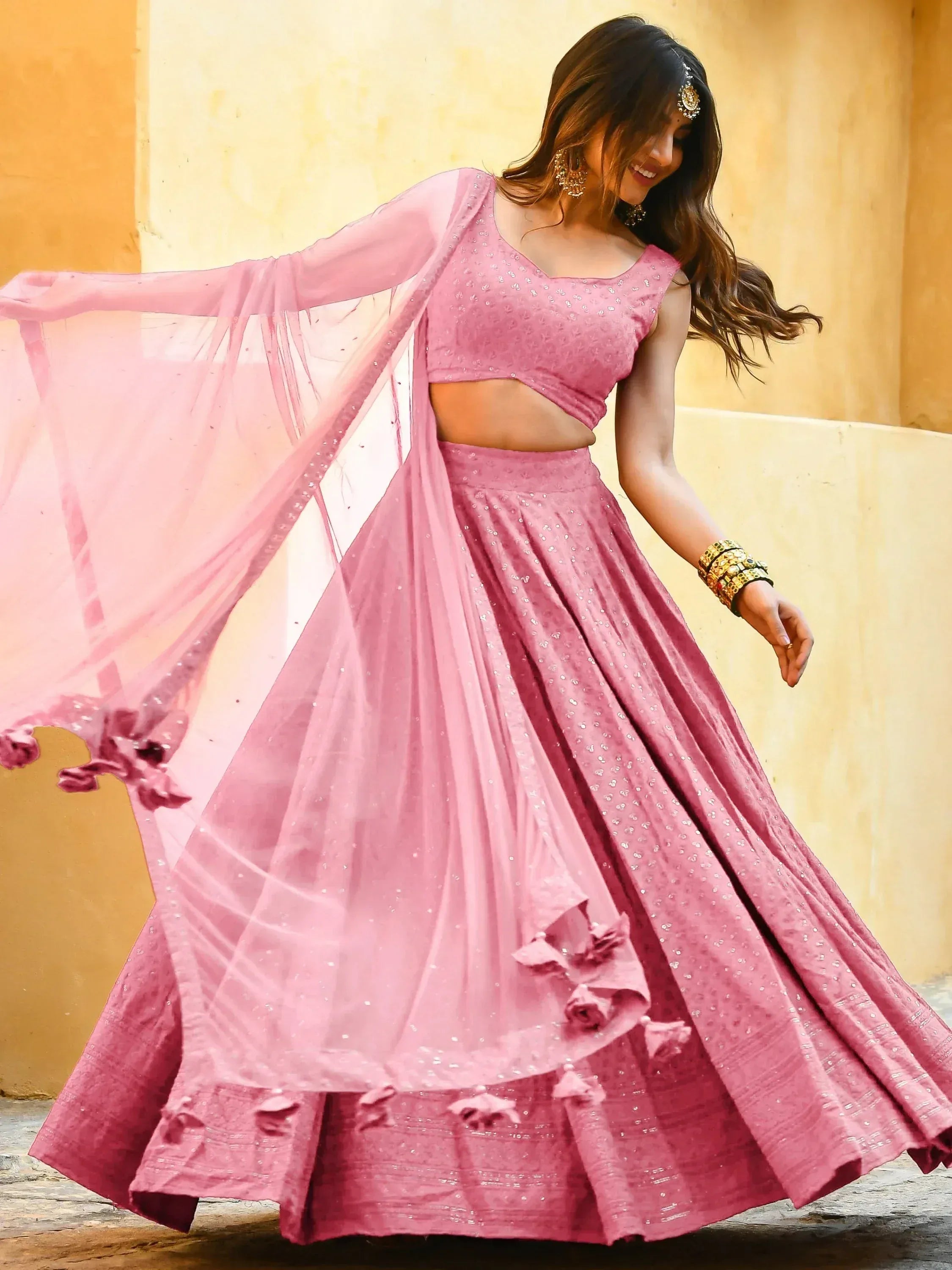 Pink designer lehenga choli with sequins and floral details, perfect for Indian ethnic wear events