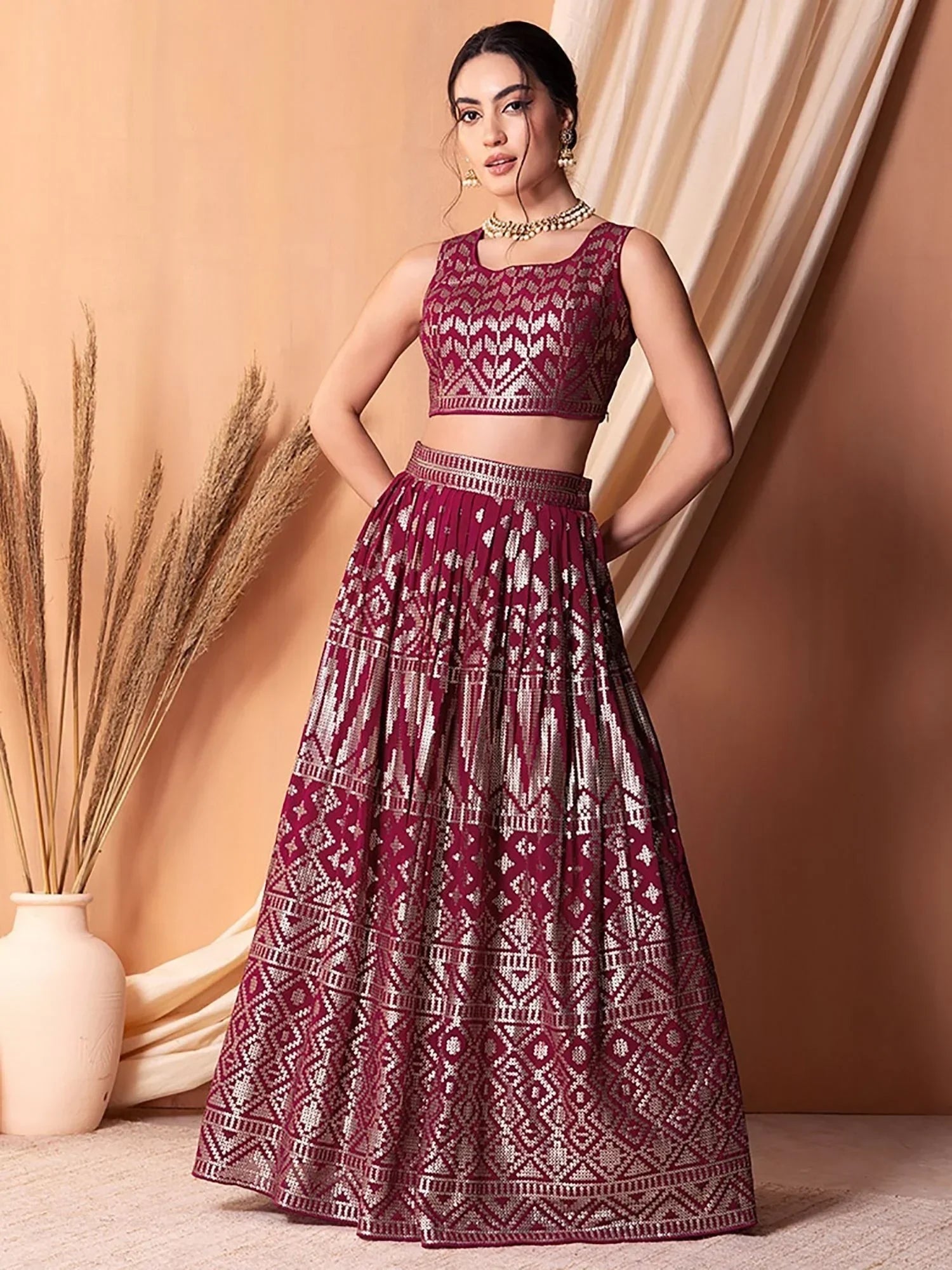 Maroon ethnic lehenga choli with silver geometric print, perfect for Indian weddings and festive occasions.