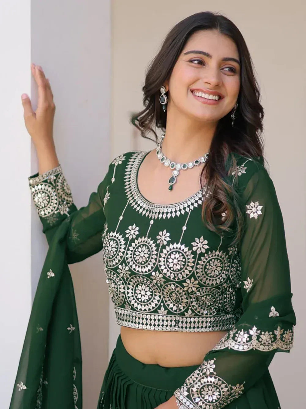 Green embroidered lehenga choli with silver mirror work, perfect for Indian ethnic wear occasions