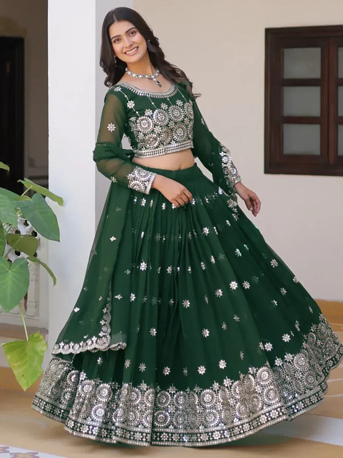 Emerald green designer lehenga choli with silver mirror work and floral embroidery for Indian ethnic wear