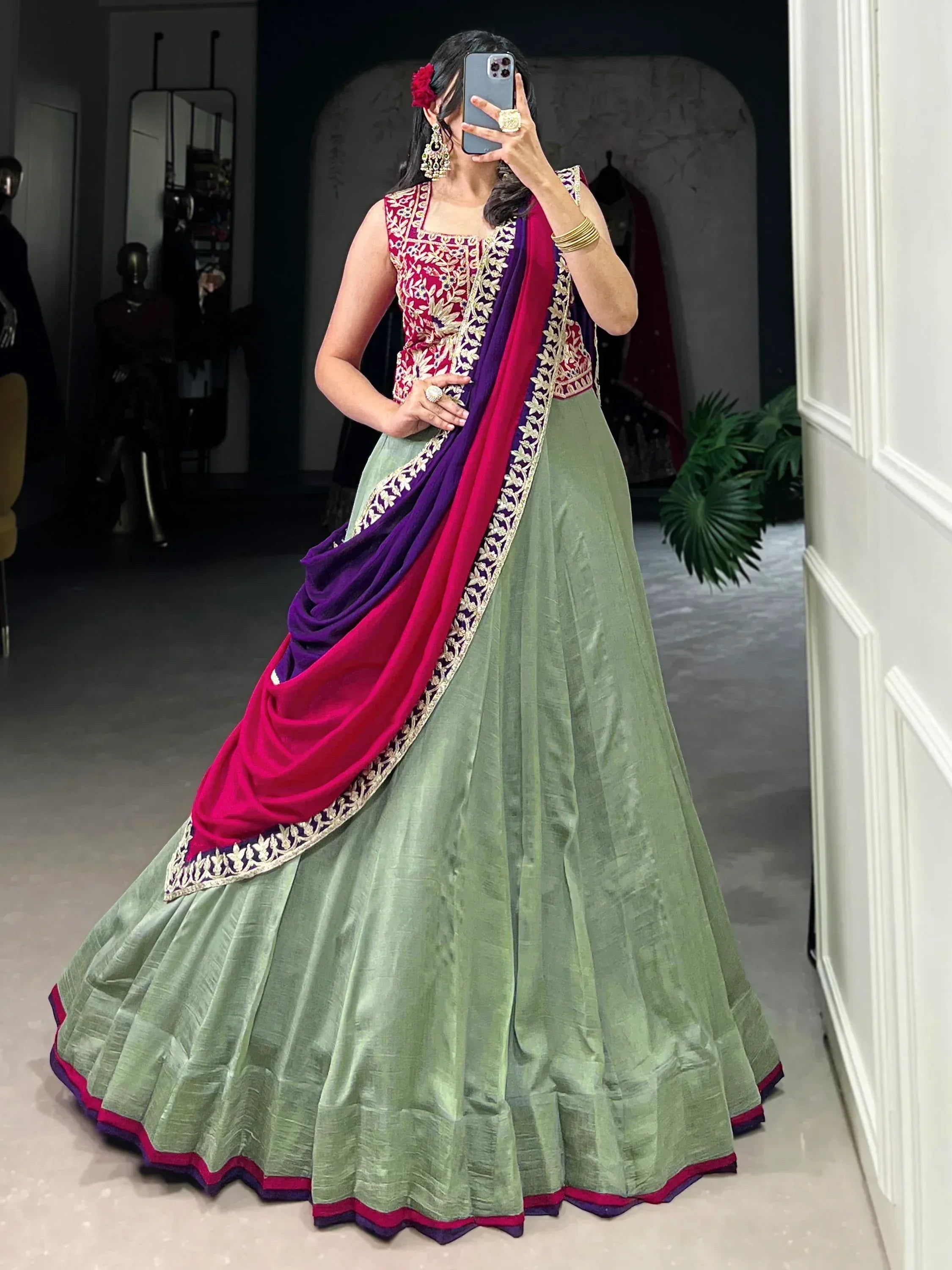 Green lehenga choli with pink and purple dupatta, floral embroidery, perfect for Indian ethnic occasions