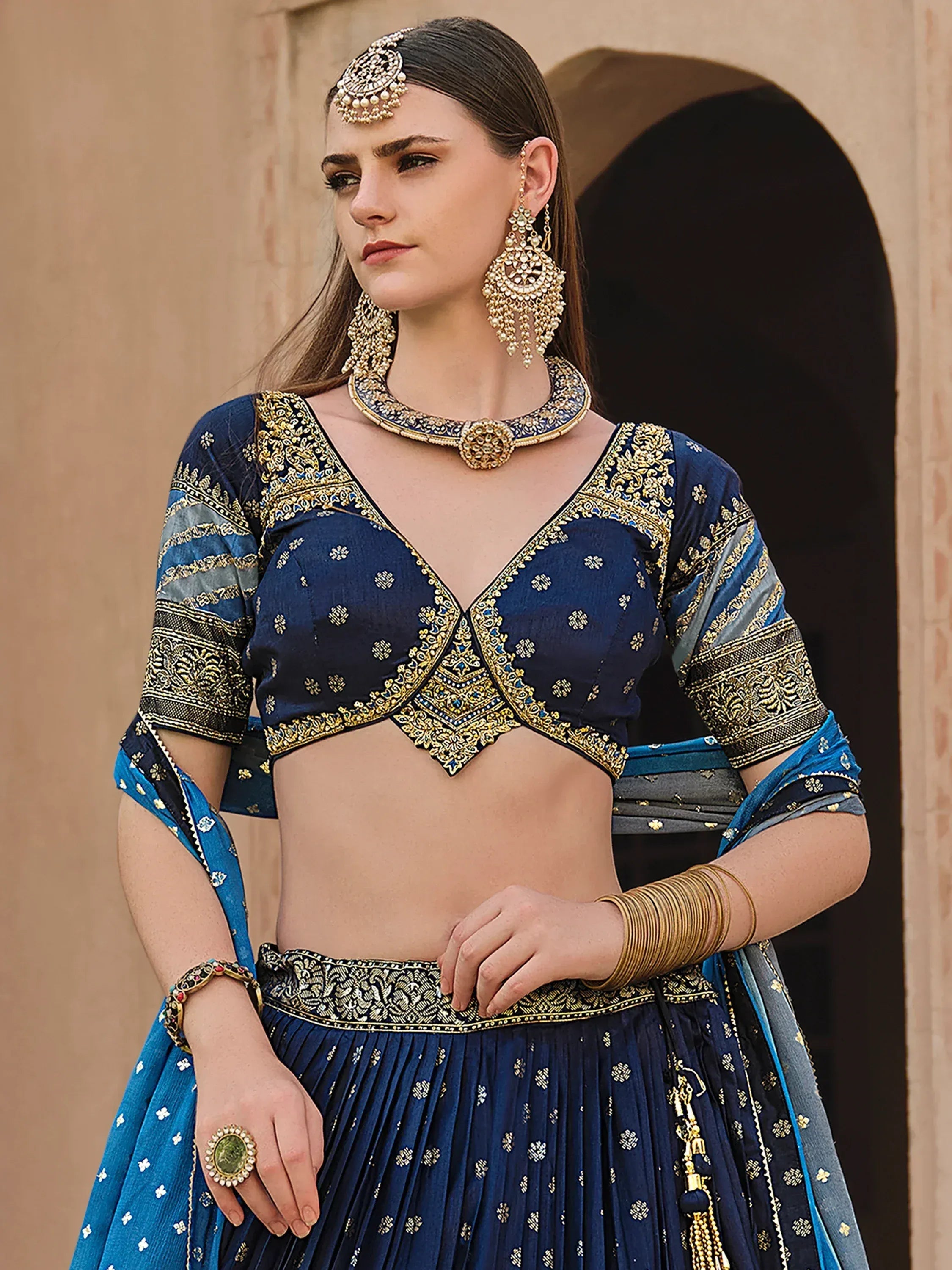 Blue embroidered lehenga choli with gold detailing, traditional Indian ethnic wear for women
