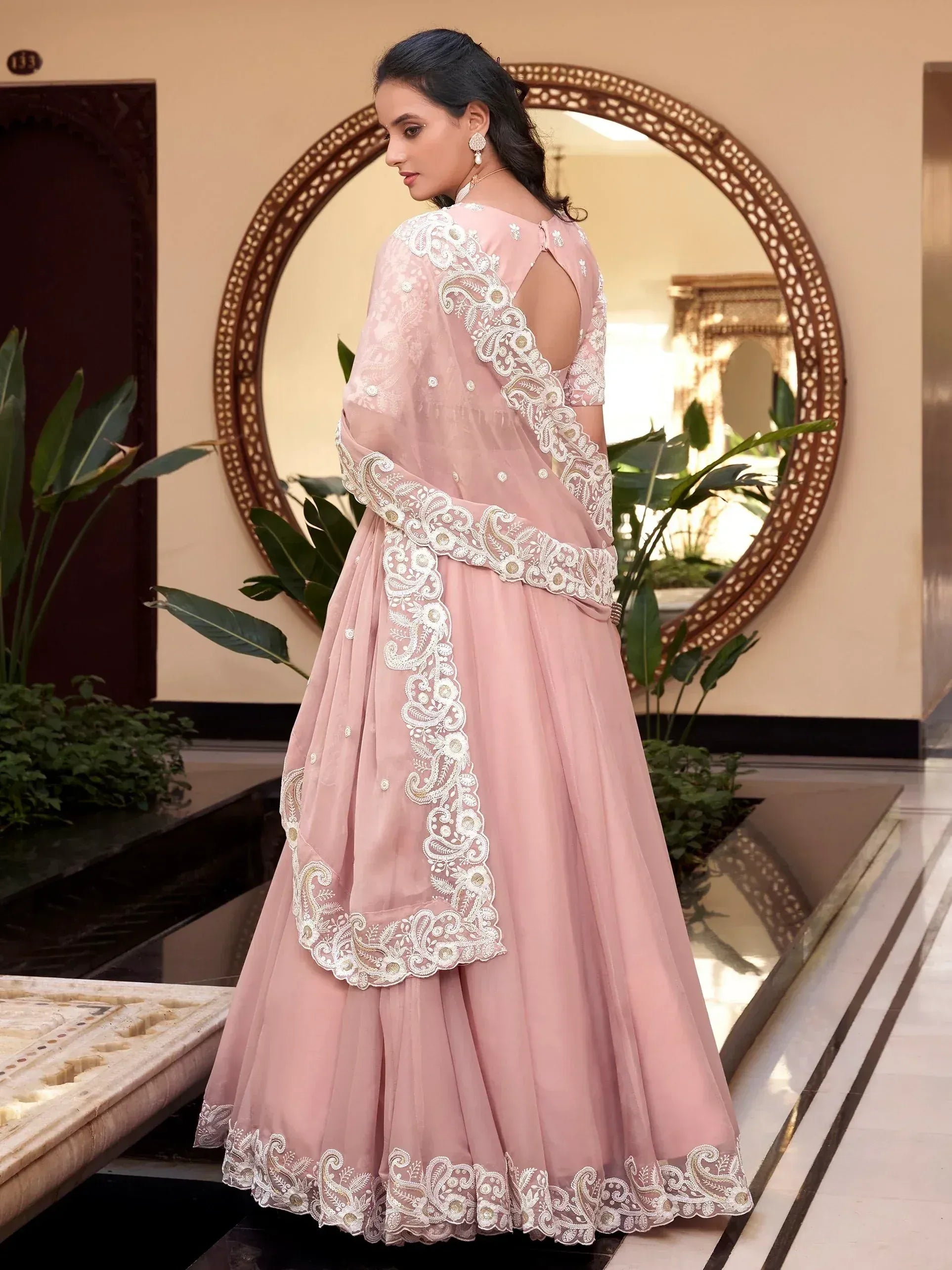 Pink designer lehenga choli with white embroidery, perfect for Indian ethnic wear occasions