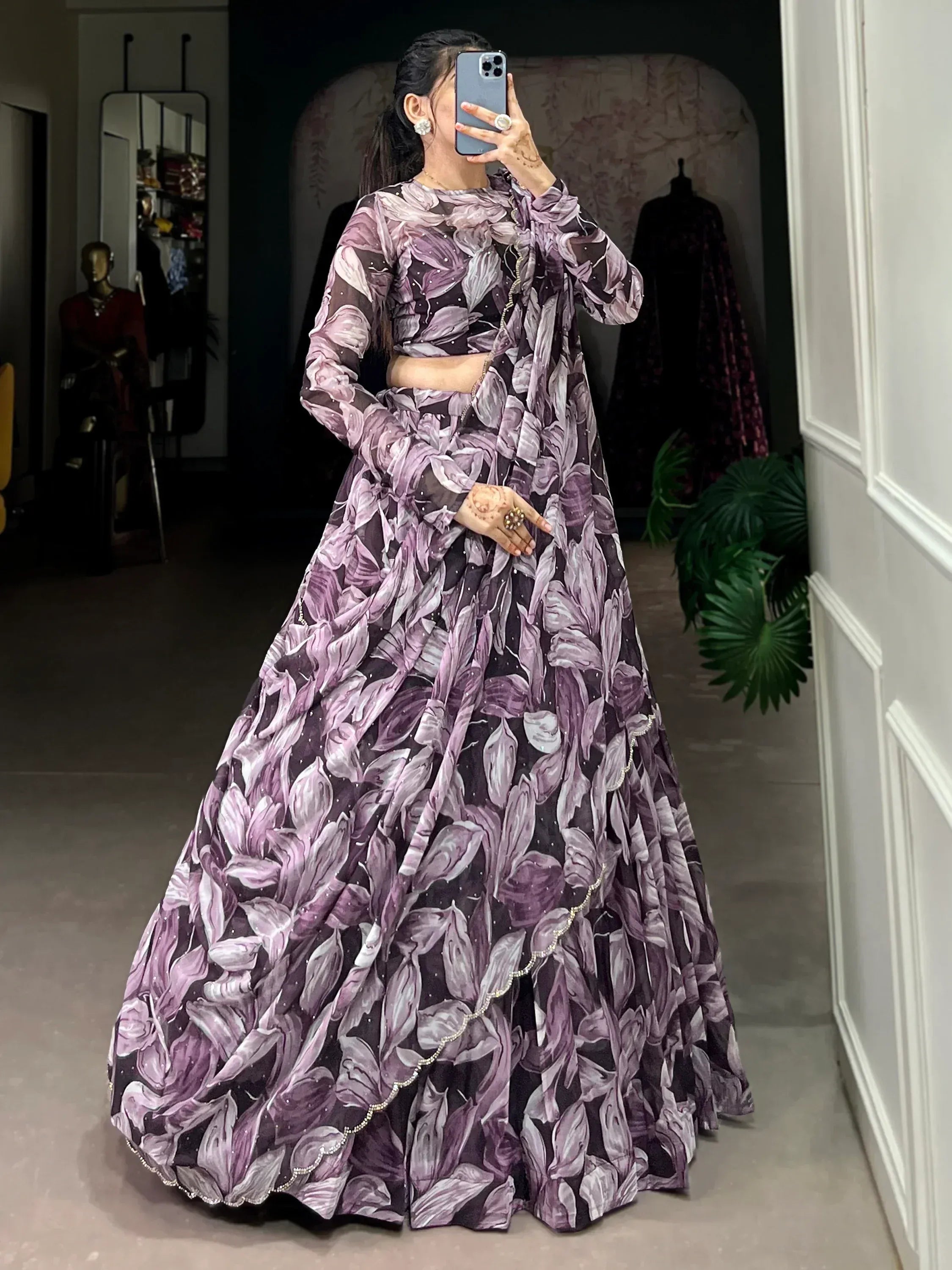 Purple floral print lehenga choli with sheer sleeves and embellished hem, perfect for Indian ethnic wear events