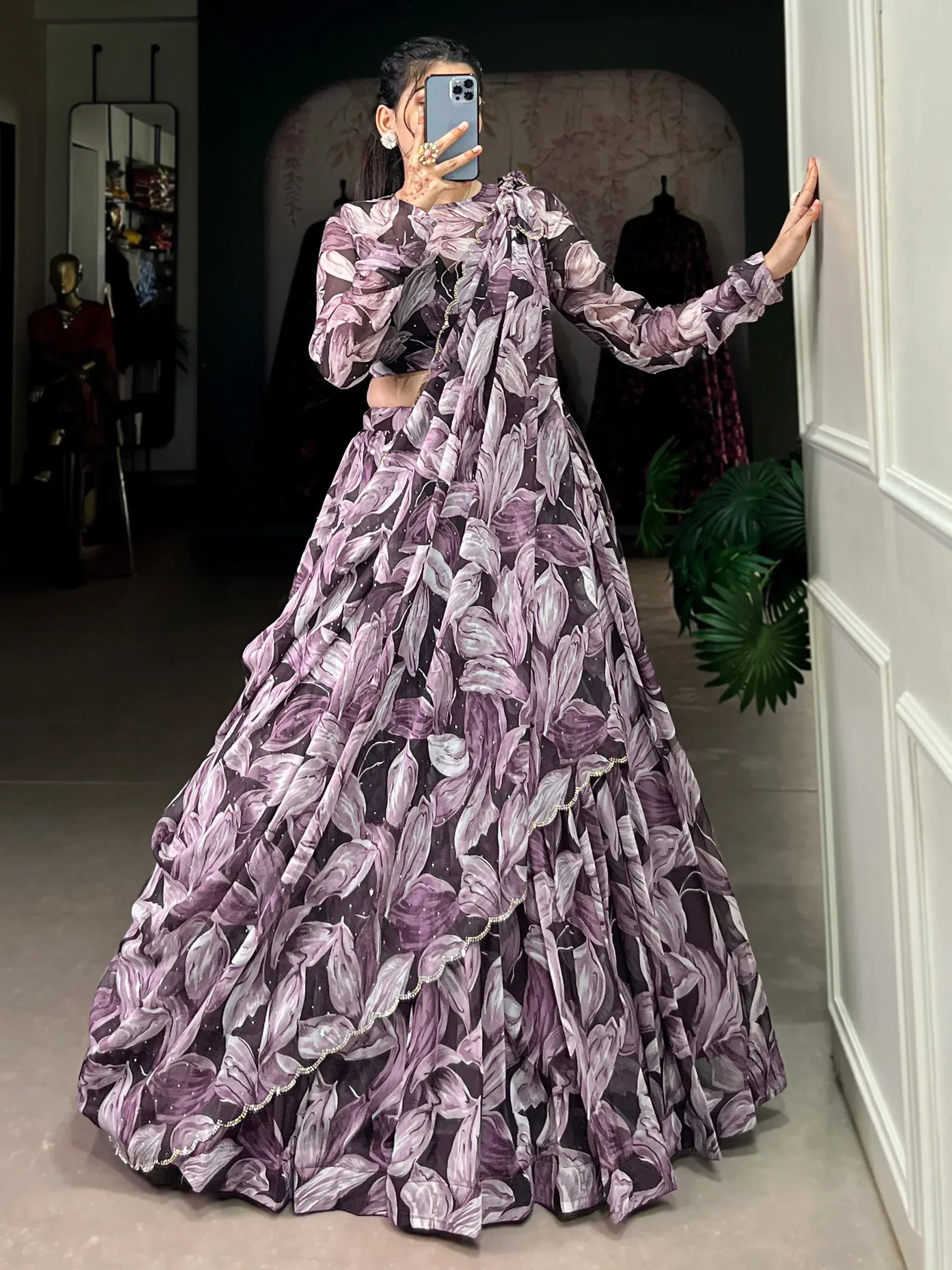 Purple floral print designer lehenga choli with sheer sleeves and embellished hem, perfect for Indian ethnic wear occasions