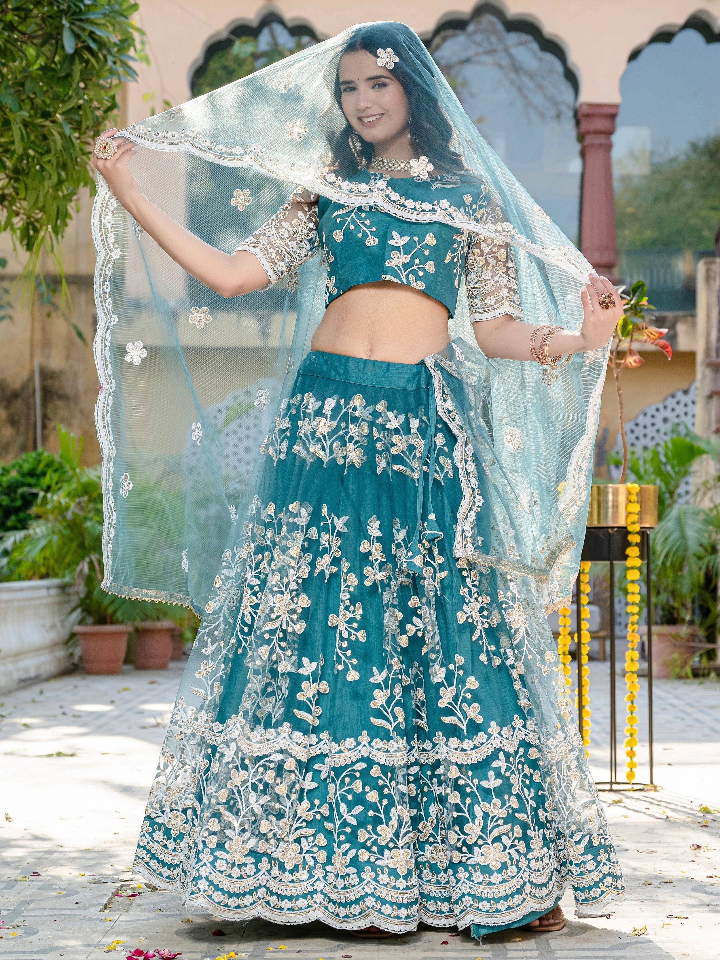 Teal embroidered lehenga choli with floral dupatta, perfect for Indian weddings and festive occasions