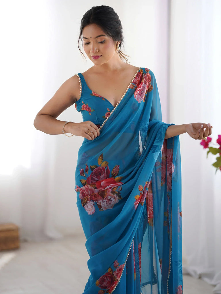 Blue floral saree with pearl trim, elegant Indian ethnic wear for women