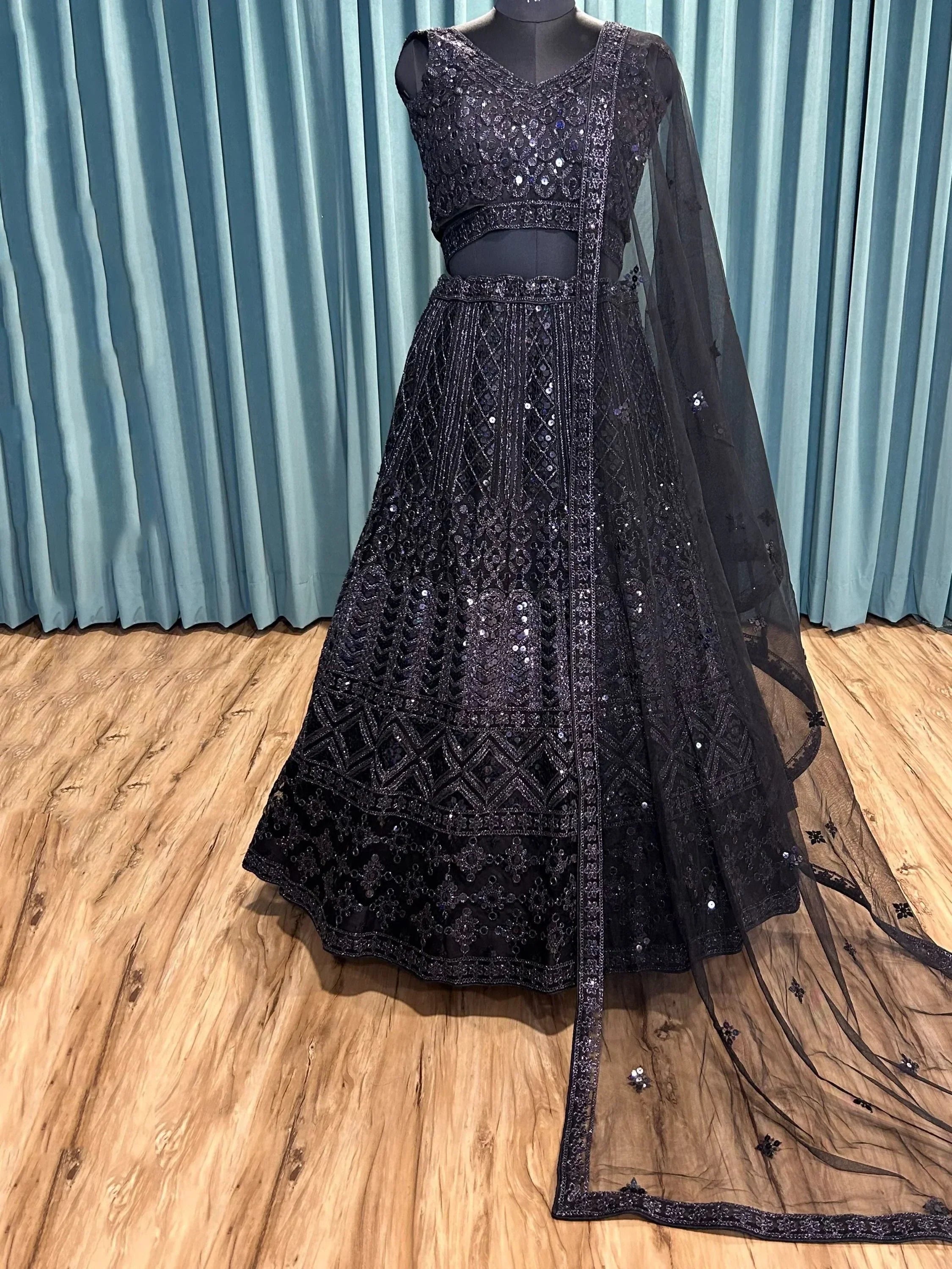 Black sequined lehenga choli with sheer dupatta, ethnic Indian wear for weddings and parties