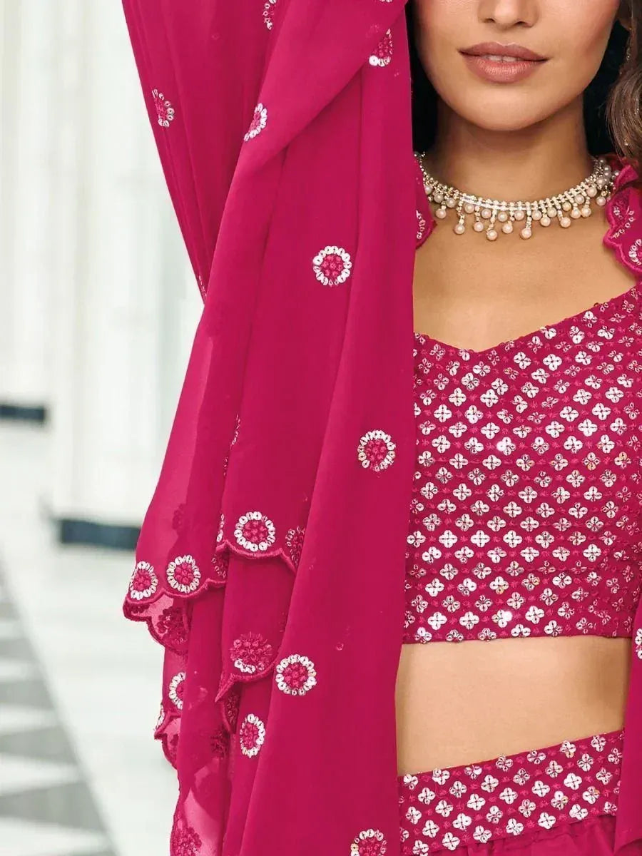 Fuchsia ethnic crop top with white floral embroidery, matching dupatta, and pearl necklace for Indian wear