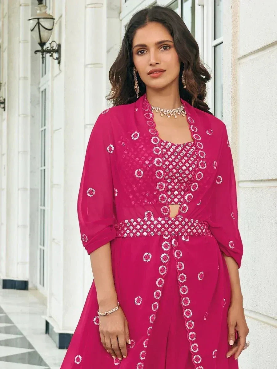 Fuchsia embroidered ethnic gown with mirror work, perfect for Indian occasions and festive wear.