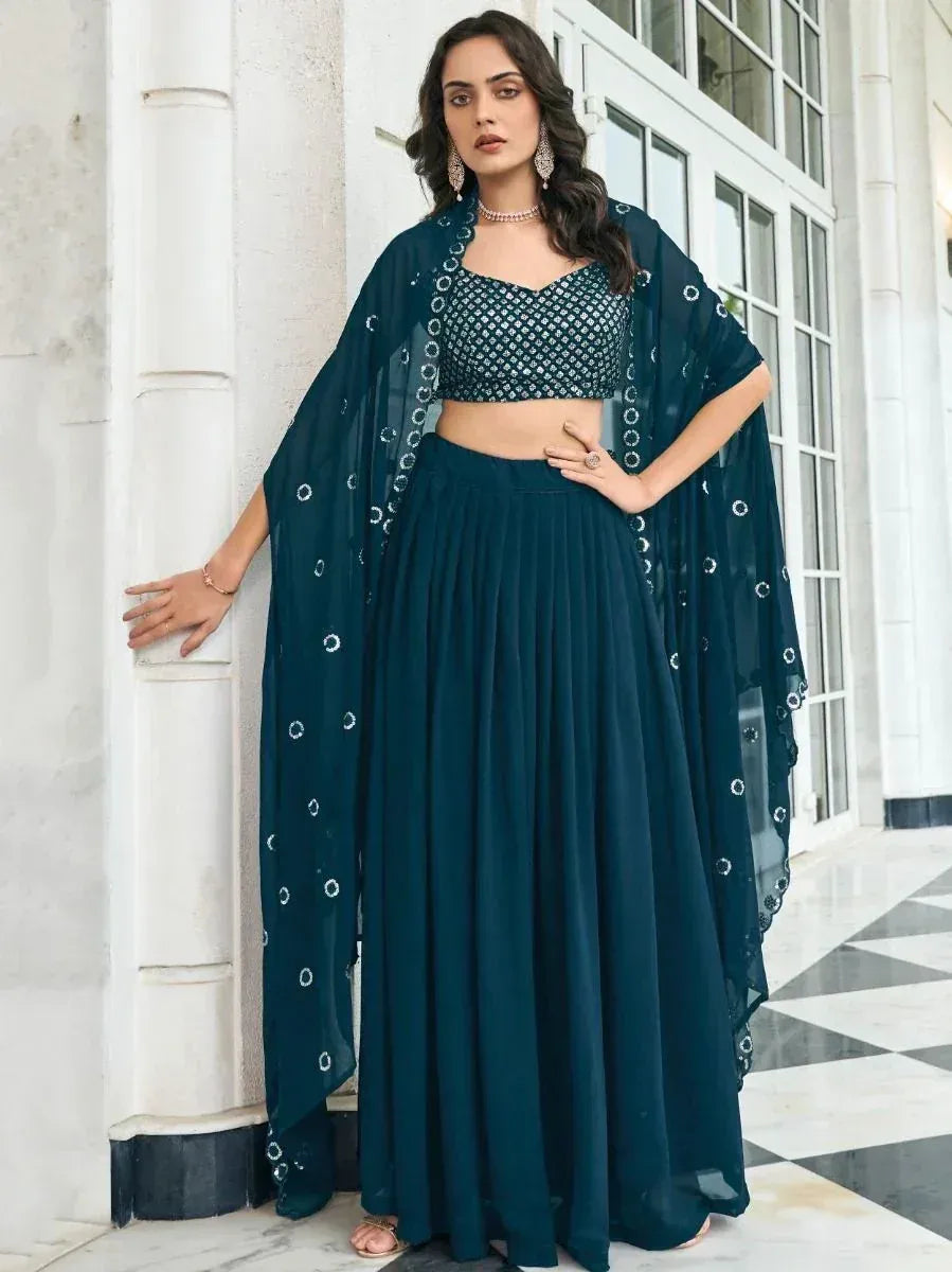 Teal ethnic lehenga choli with embroidered dupatta, perfect for Indian weddings and festive occasions