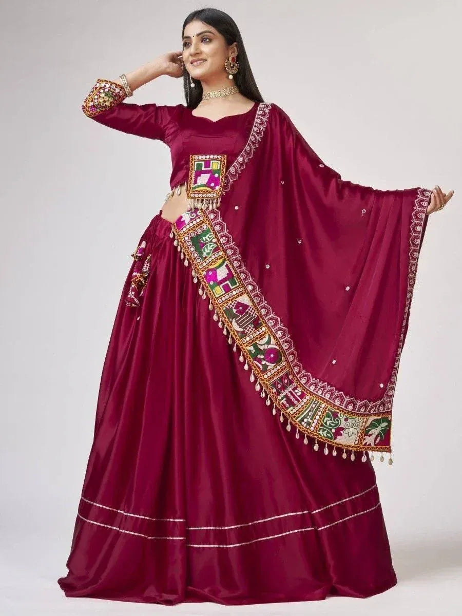 Maroon ethnic lehenga choli with colorful mirror work and embroidered dupatta for Indian occasions