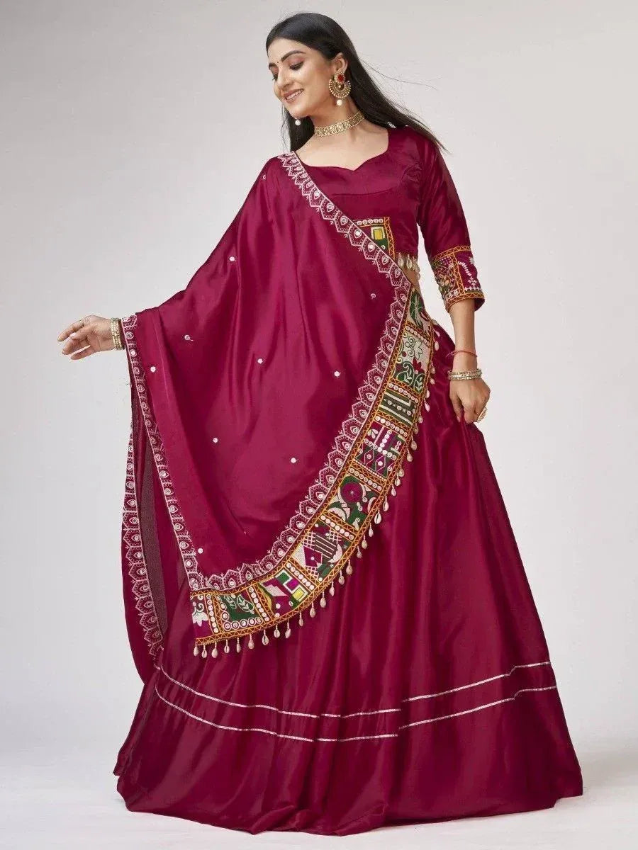 Maroon ethnic gown with embroidered dupatta, perfect for Indian weddings and festive occasions