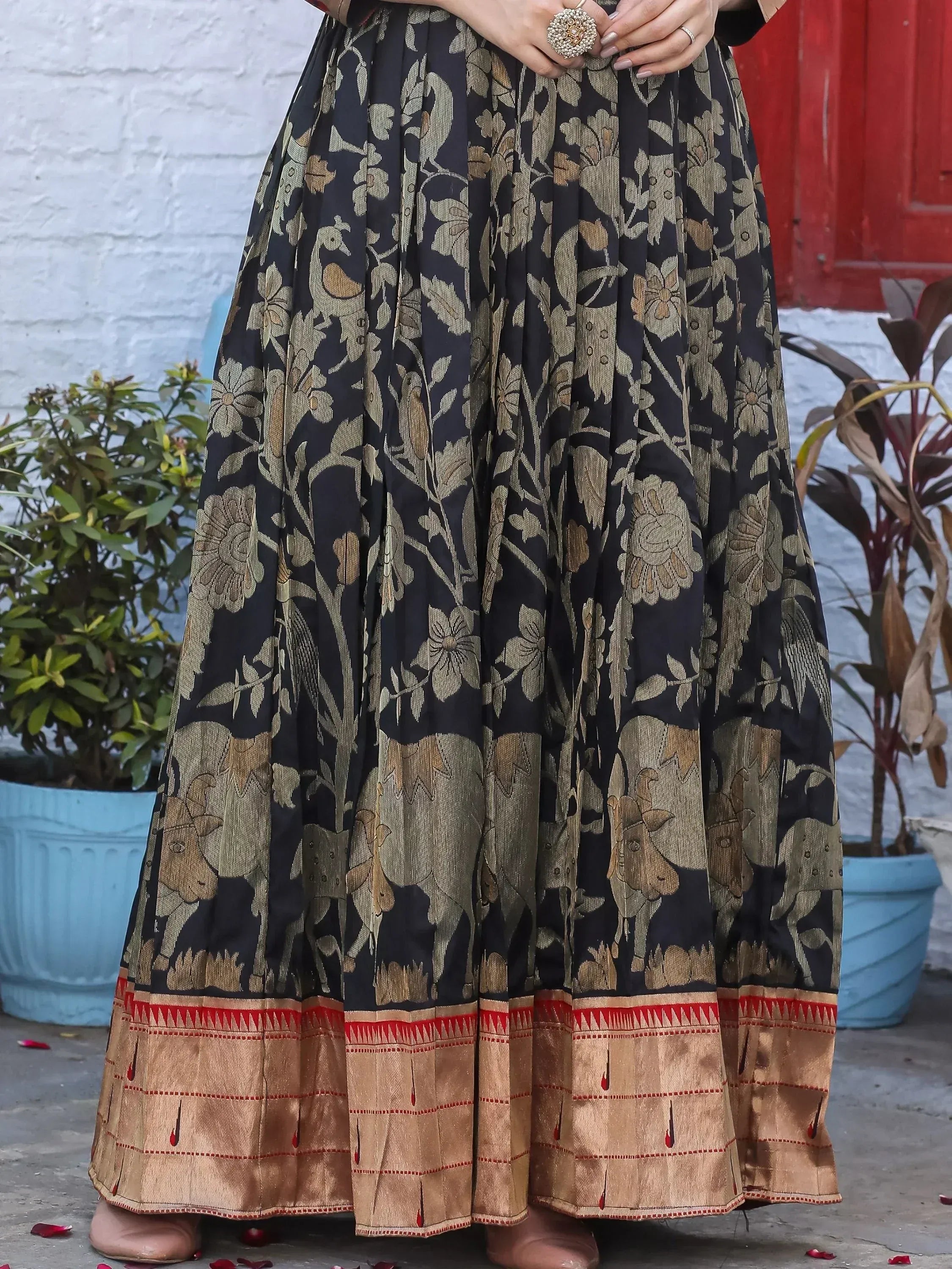 Black and gold floral peacock print ethnic skirt with red border, perfect for Indian wear