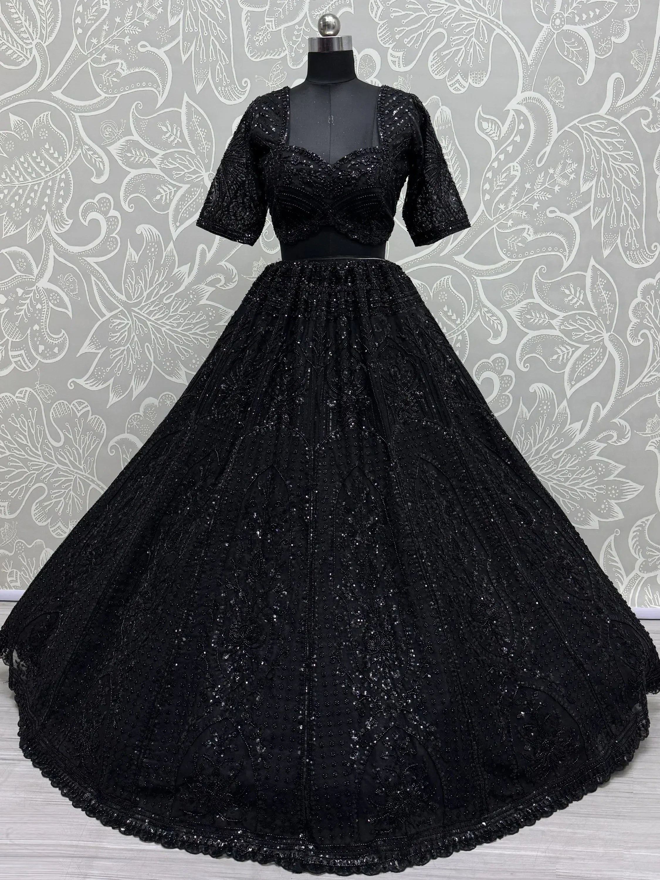Black embroidered lehenga choli with sequin work, perfect for Indian ethnic wear and festive occasions.