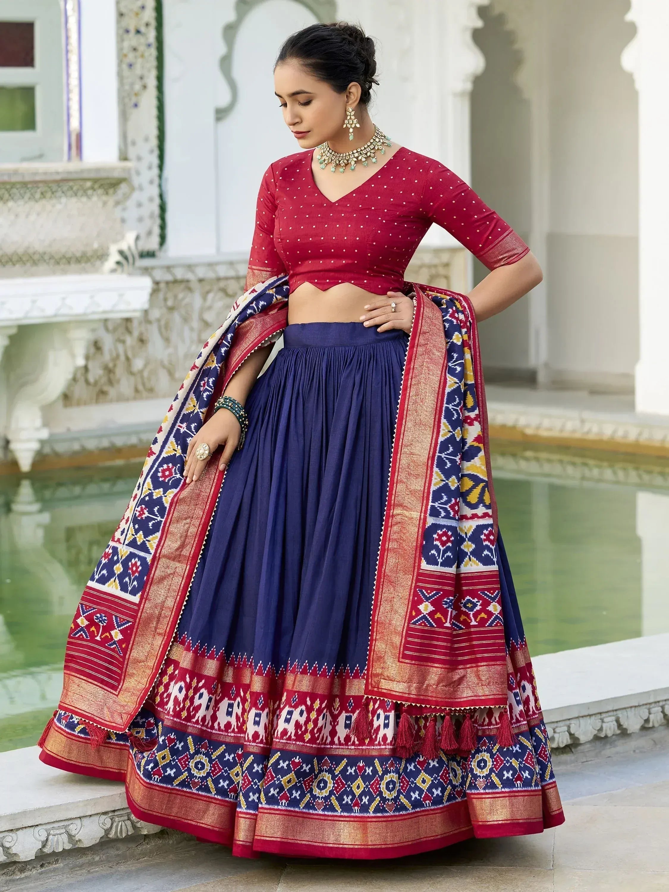 Red and navy blue ethnic lehenga choli with printed dupatta, perfect for Indian weddings and festivals