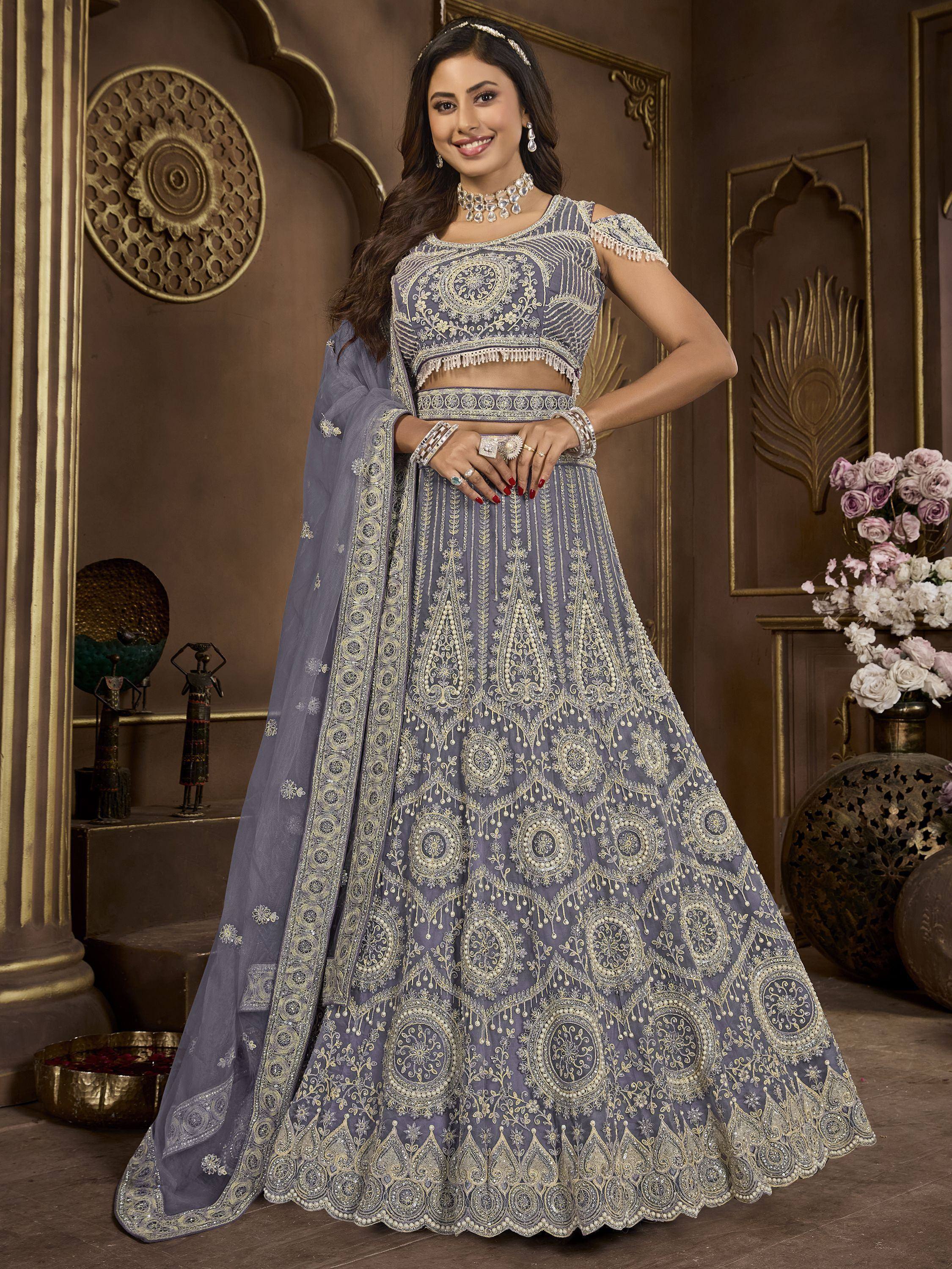 Elegant grey lehenga choli with gold embroidery, perfect for Indian weddings and festive occasions.