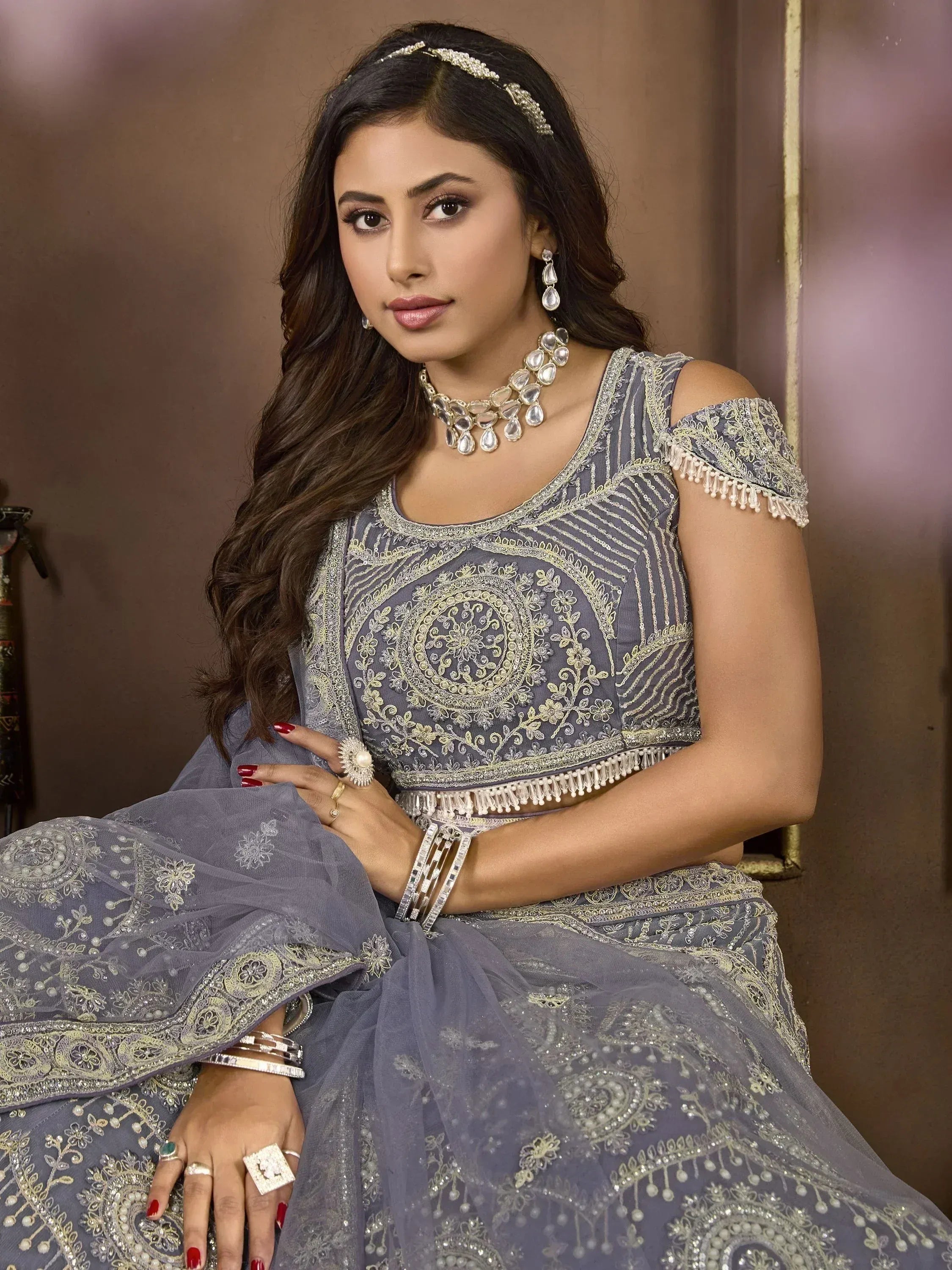 Elegant grey embroidered lehenga choli with gold detailing, perfect for Indian ethnic wear occasions.