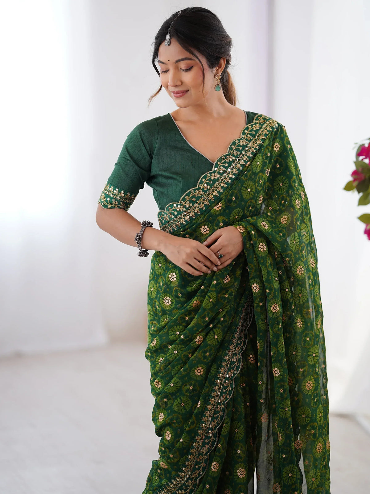 Green floral printed saree with gold embroidery, perfect for Indian ethnic wear occasions