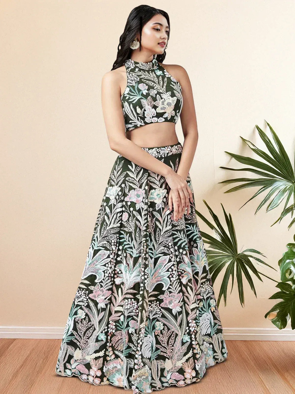 Floral embroidered green lehenga choli with halter neck top, perfect for Indian ethnic wear occasions