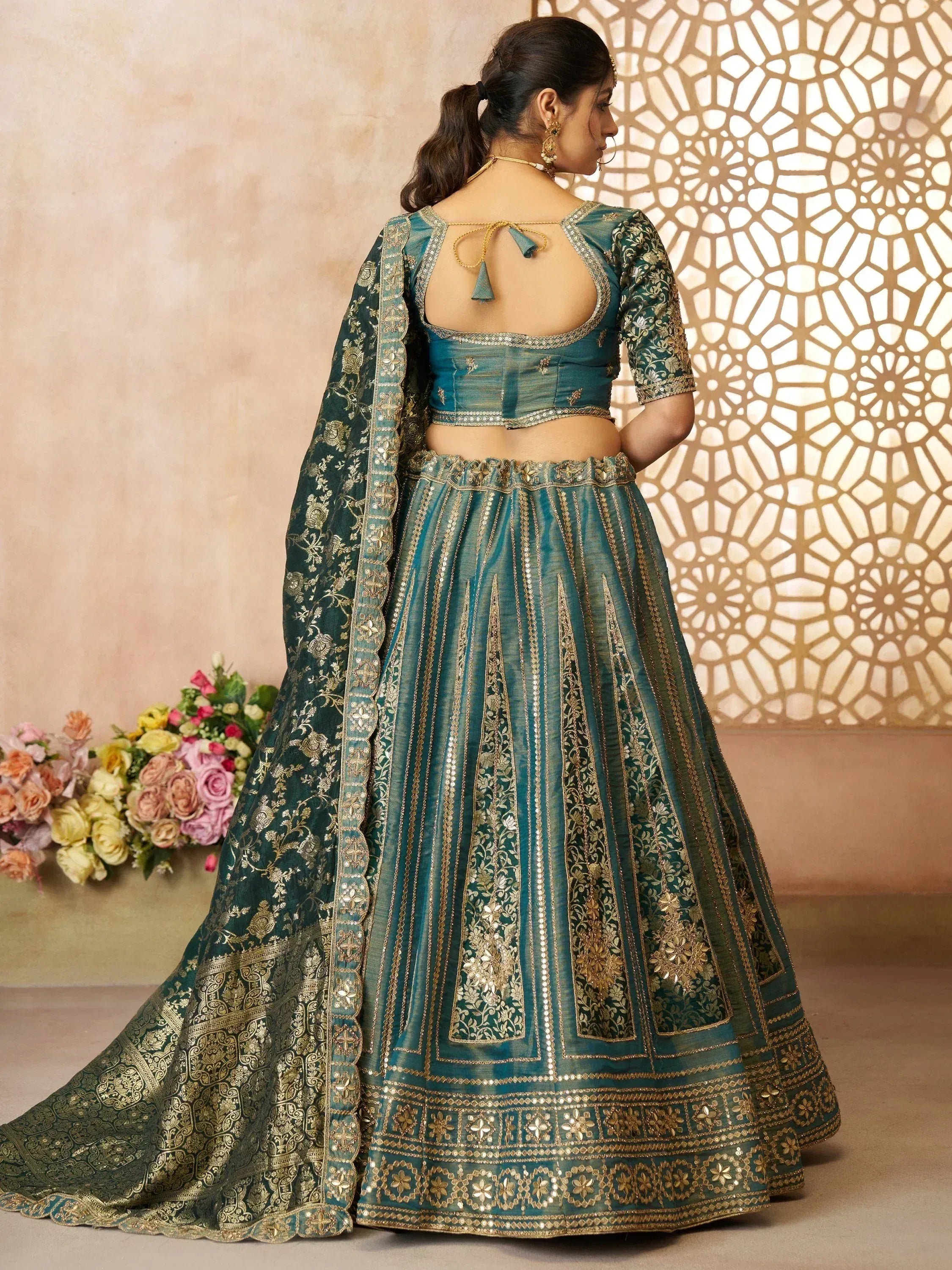 Teal designer lehenga choli with gold embroidery, back view, ethnic Indian wear